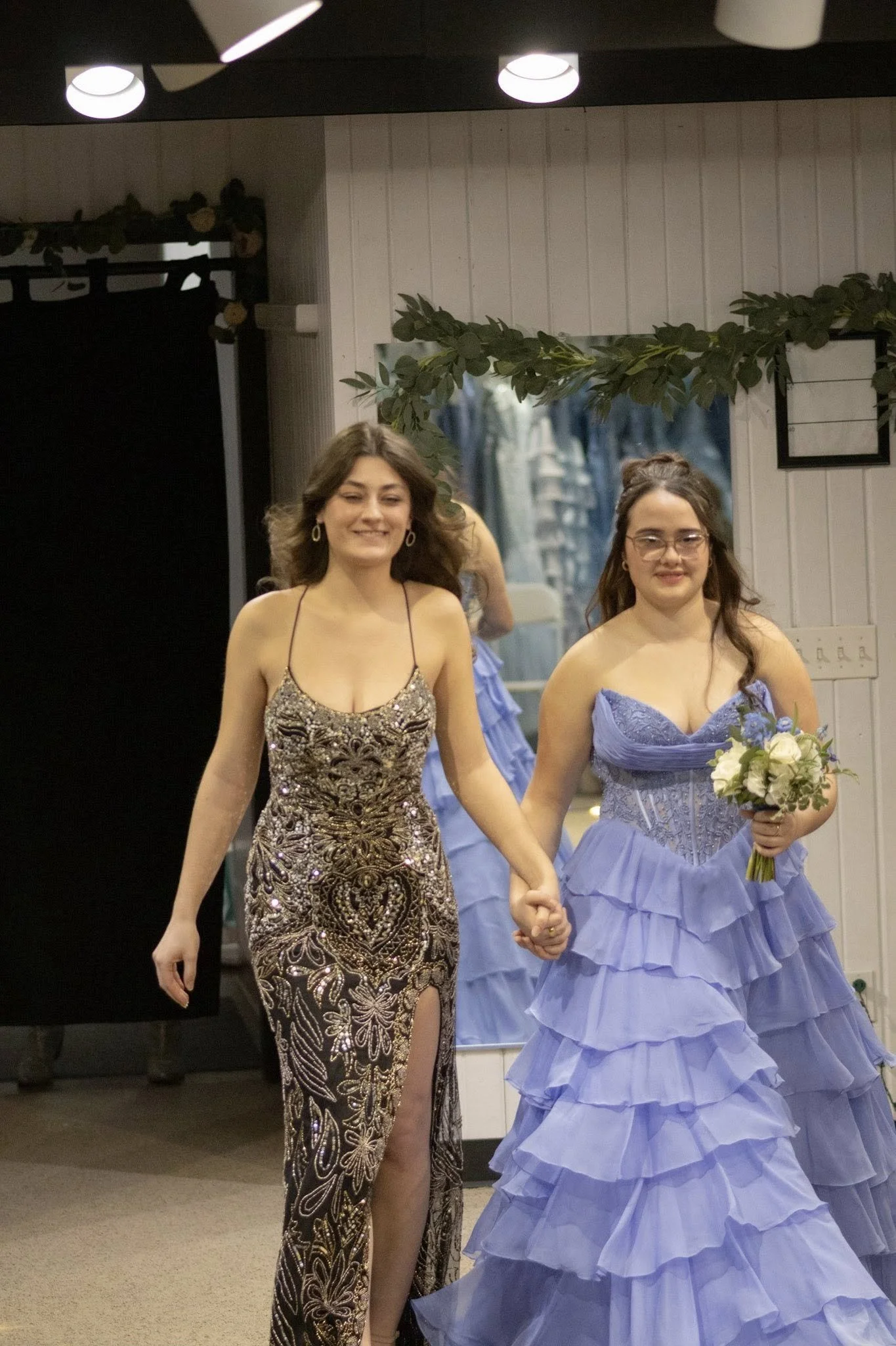 girls wearing prom dresses