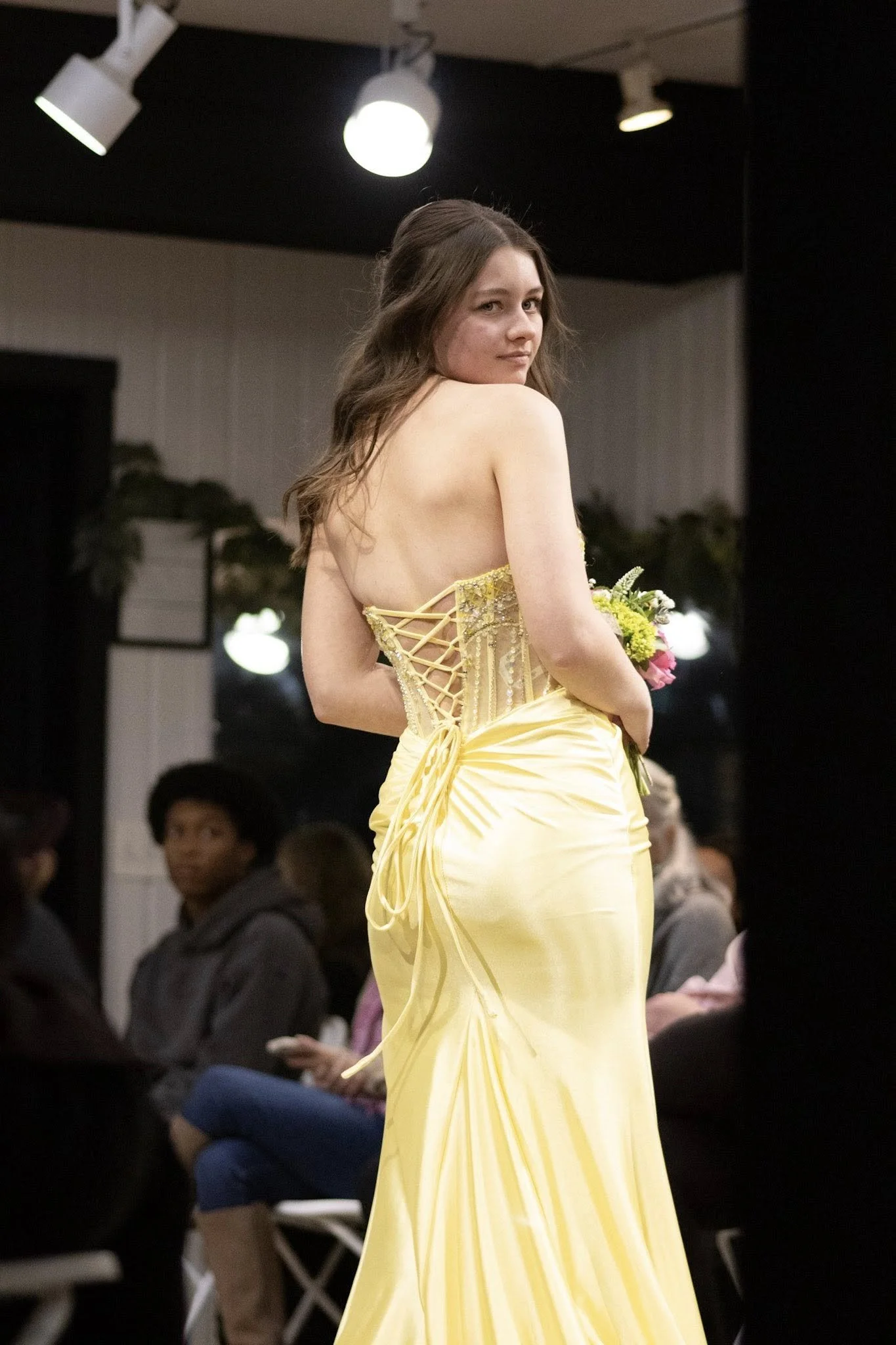 girls wearing prom dresses