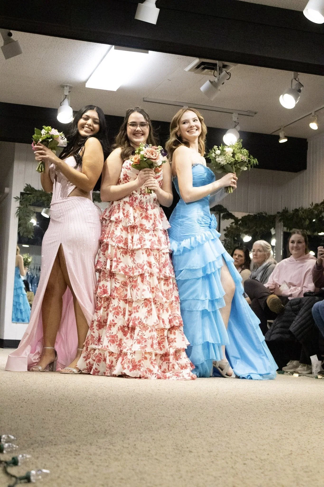 girls wearing prom dresses