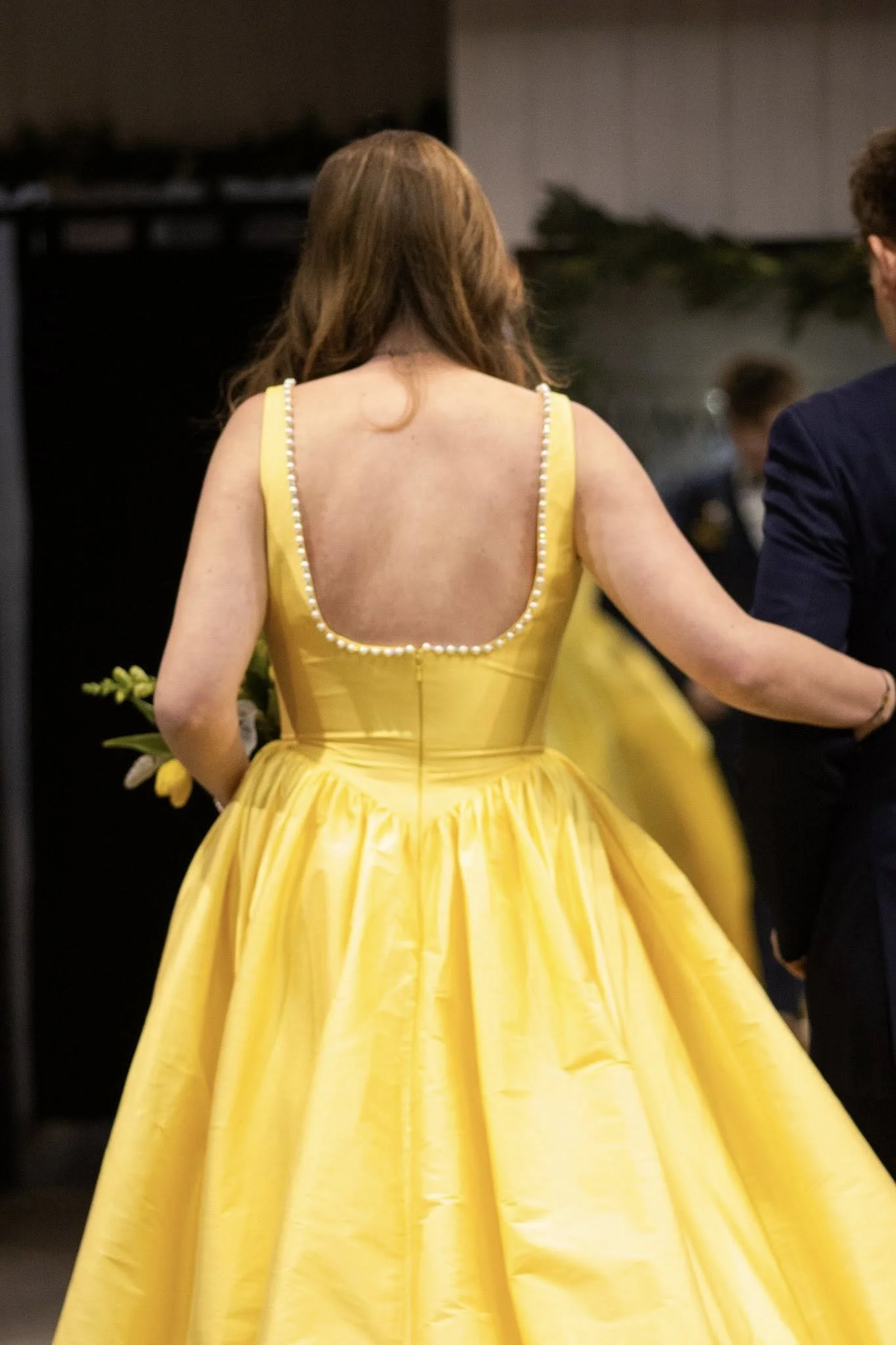 girls wearing prom dresses