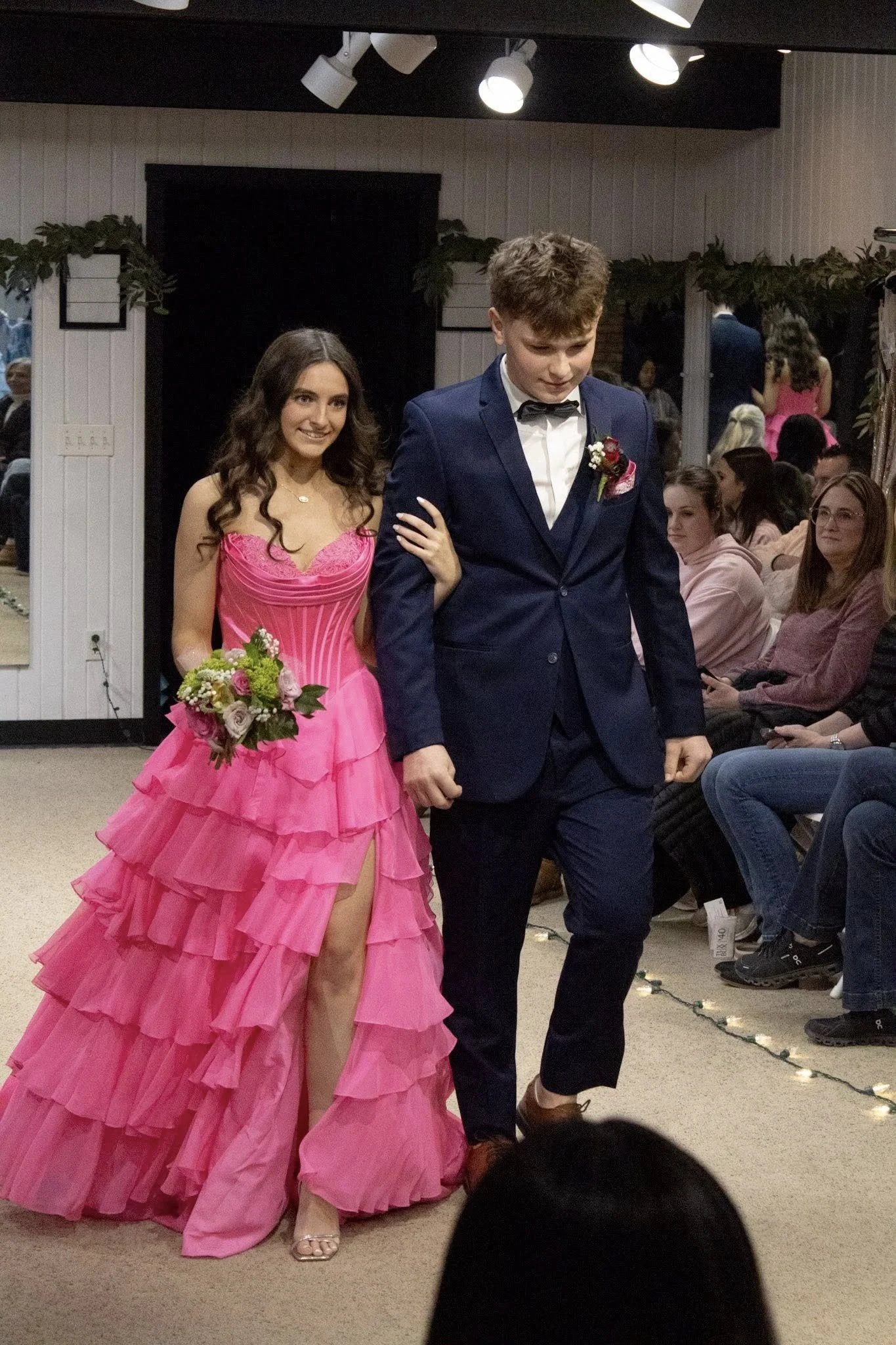 girls wearing prom dresses