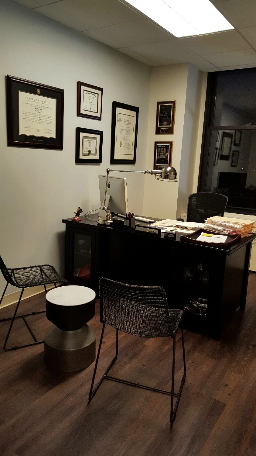 From Organic Modernism a beautiful chrome finished halo table lamp sits upon the Kathy Ireland Tribeca Office Desk. A marble steel nickel Silo table, flanked by two Reed chairs are from CB2