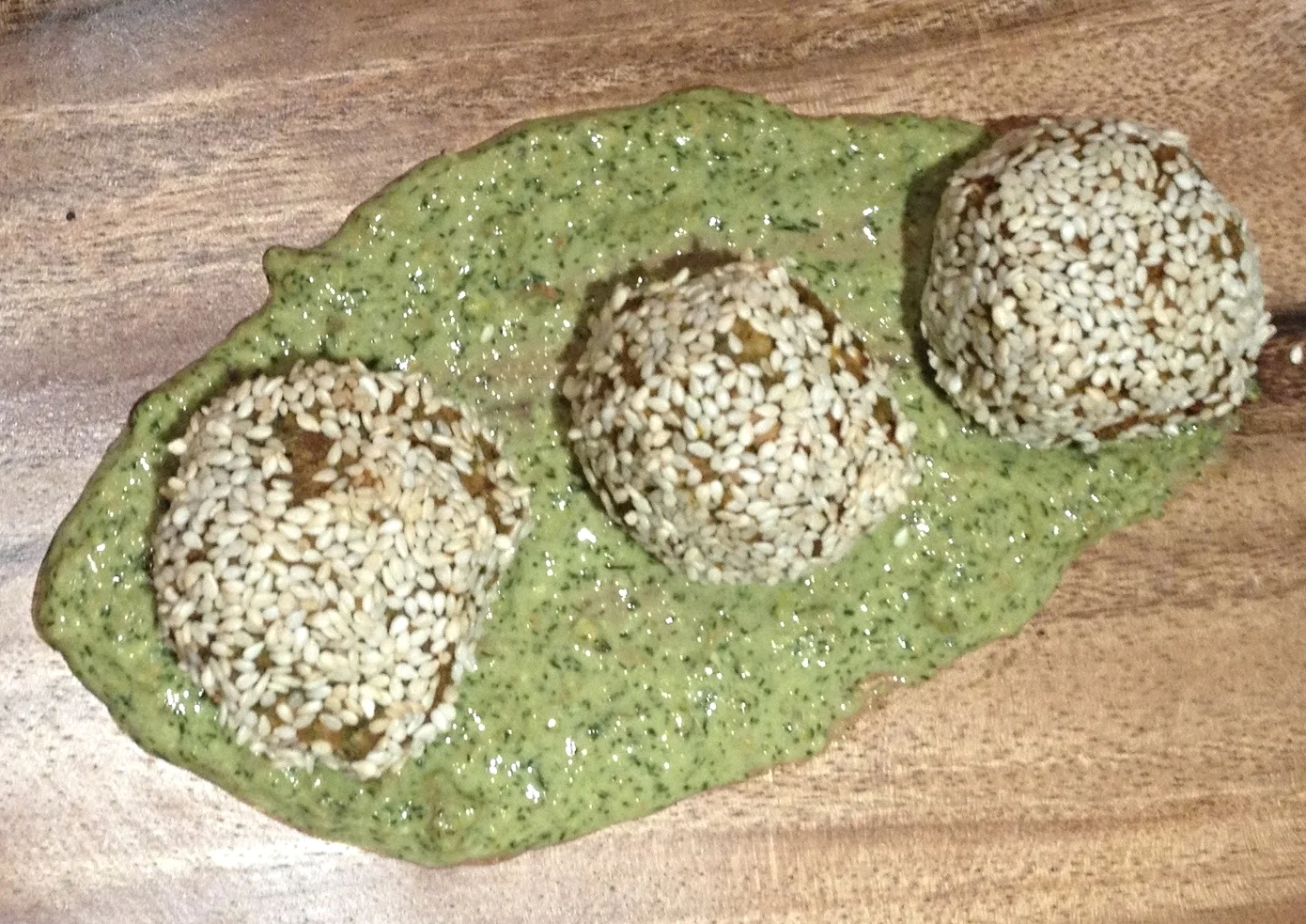 Carrot, dried apricot and herb baked fritters in pistachio dill pesto