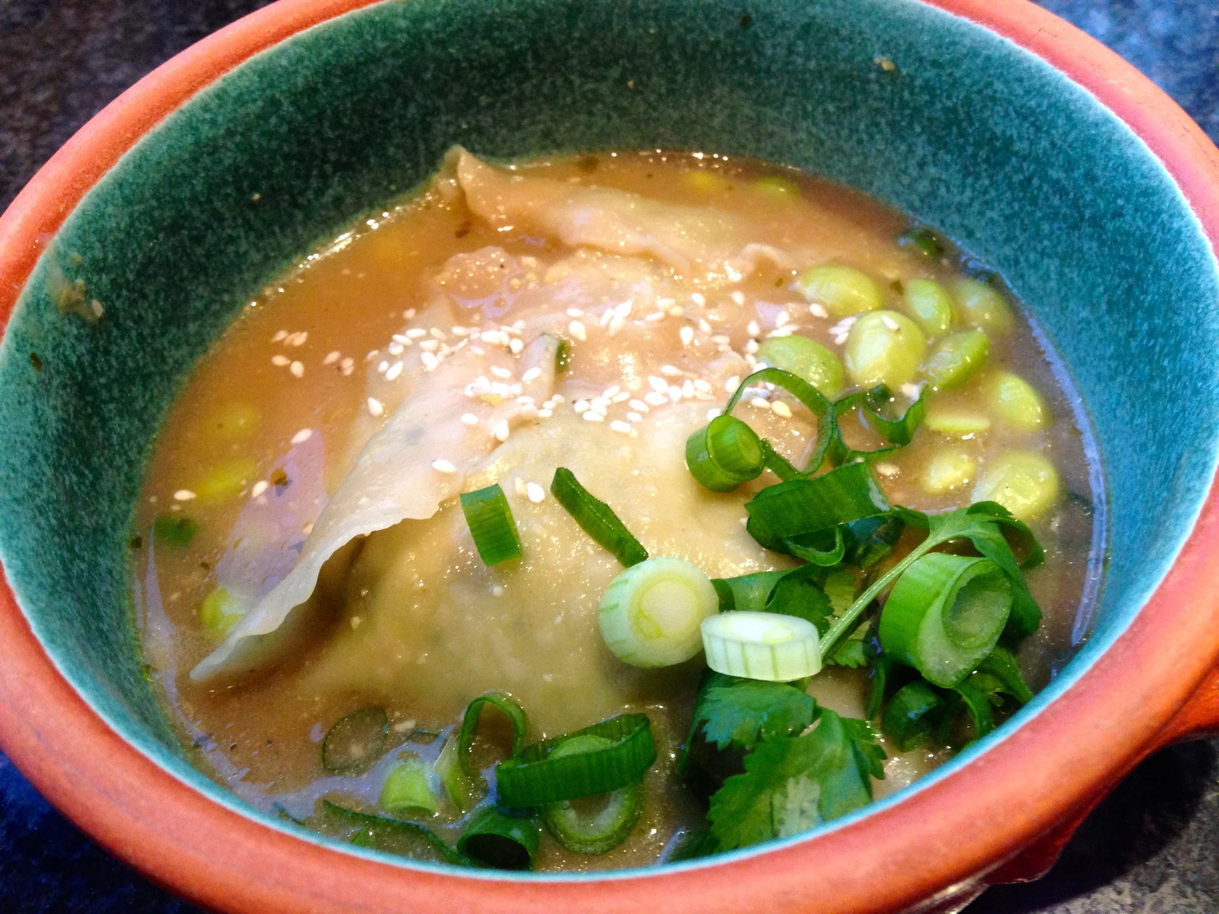Edamame dumplings in vegetable and white truffle broth