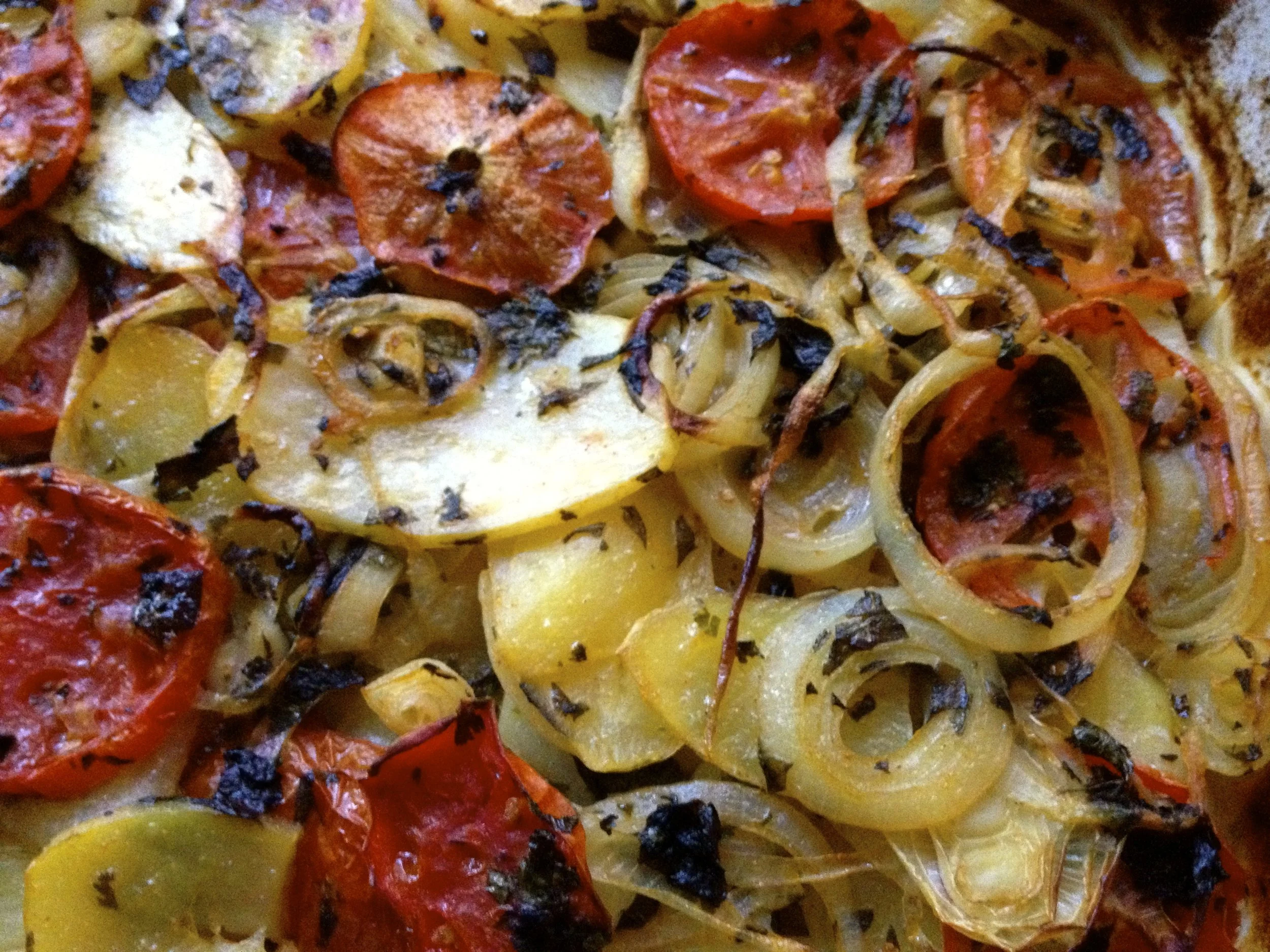 Mediterranean potato, onion, tomato and fresh herb bake