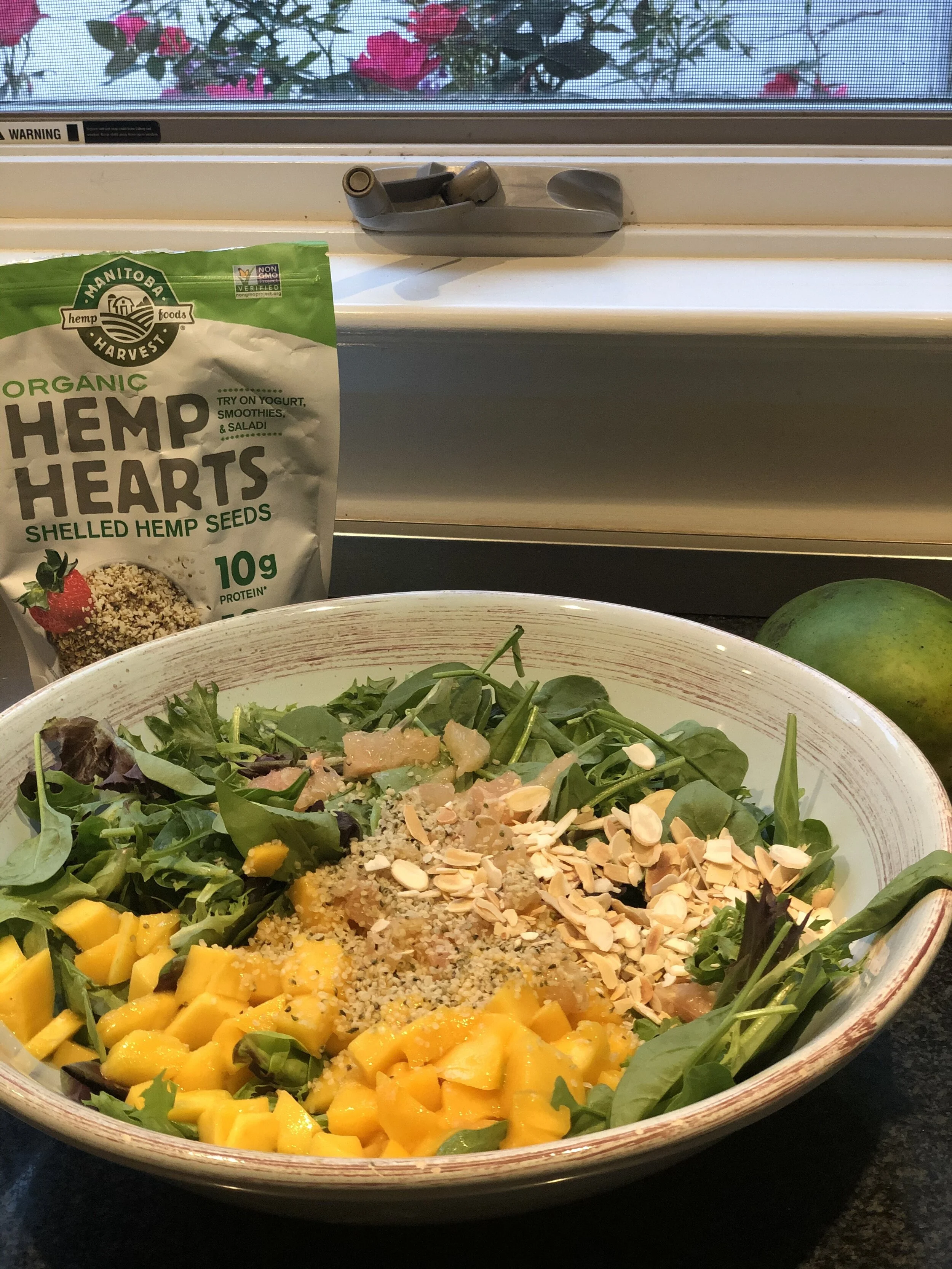 Green salad with mango, citrus and slivered almonds, with a quick vinaigrette