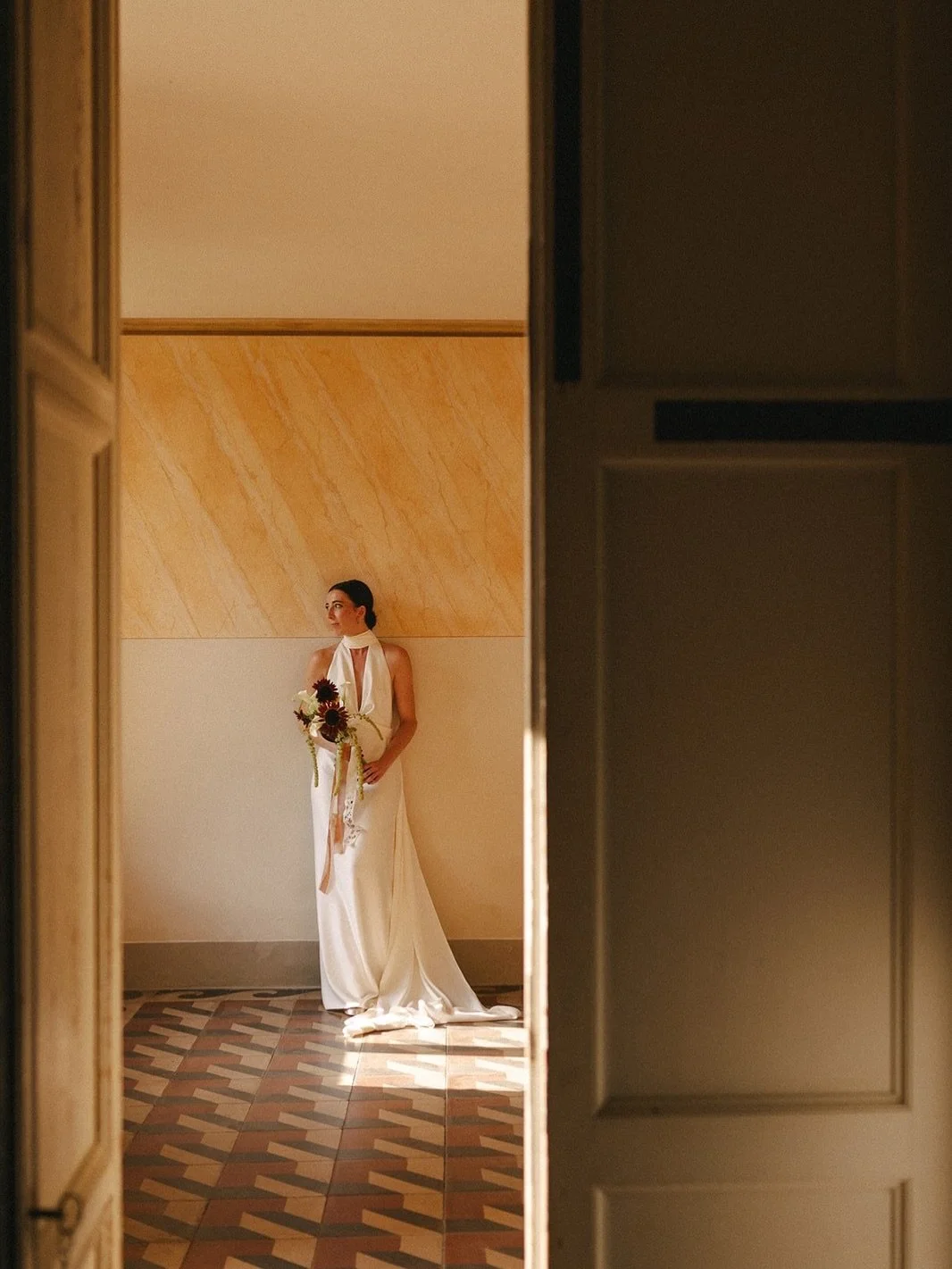 Just one step back, behind the door.
Close enough for anything you might need &mdash;
far enough for the moment to belong entirely to you.
&bull;
#weddingplannerinitaly #destinationweddinginitaly #weddinginveneto #elisaegiuliaweddings #italianwedding