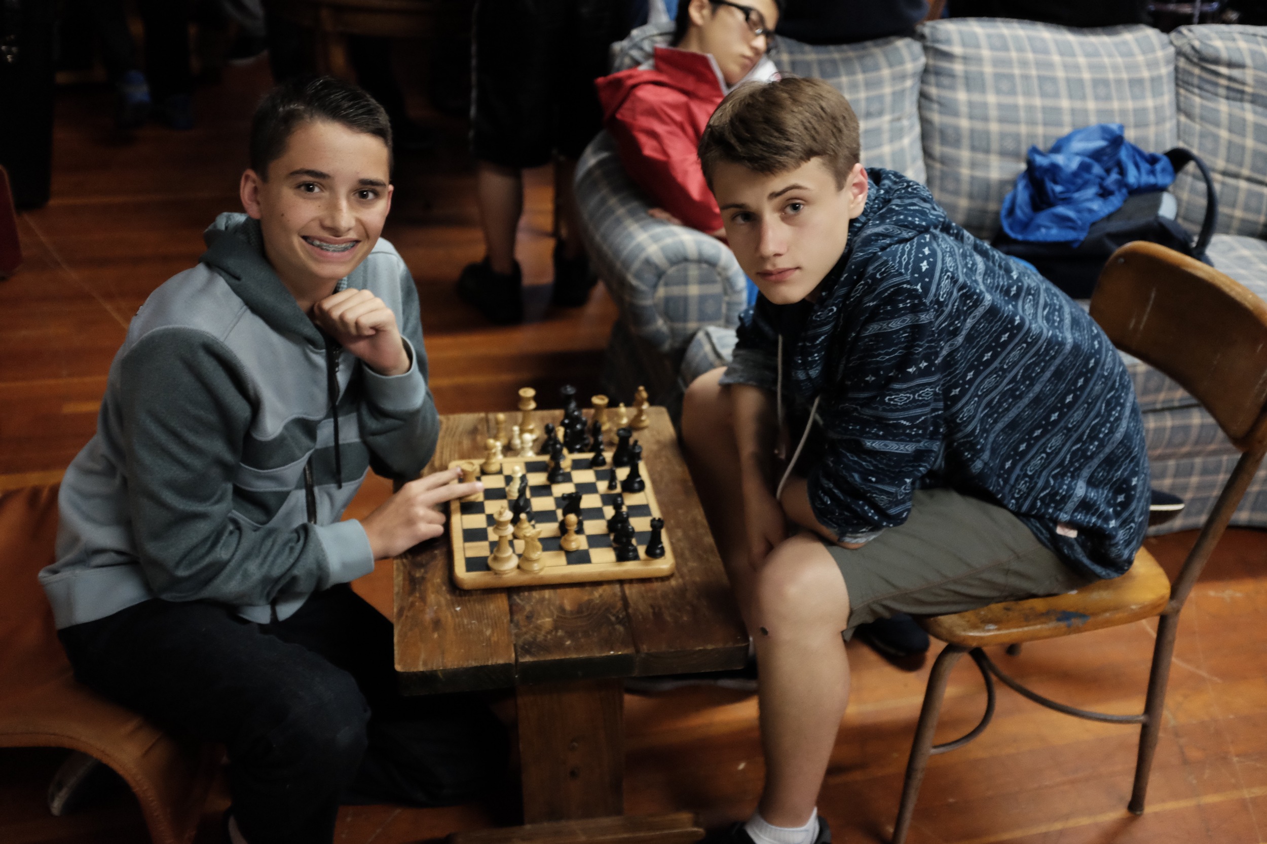 Two campers play a competitive game of chess 