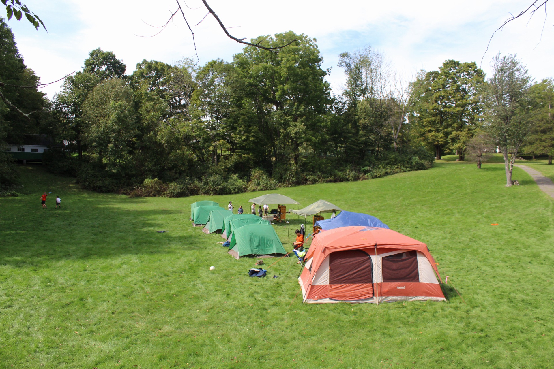  A row of tents in a field 