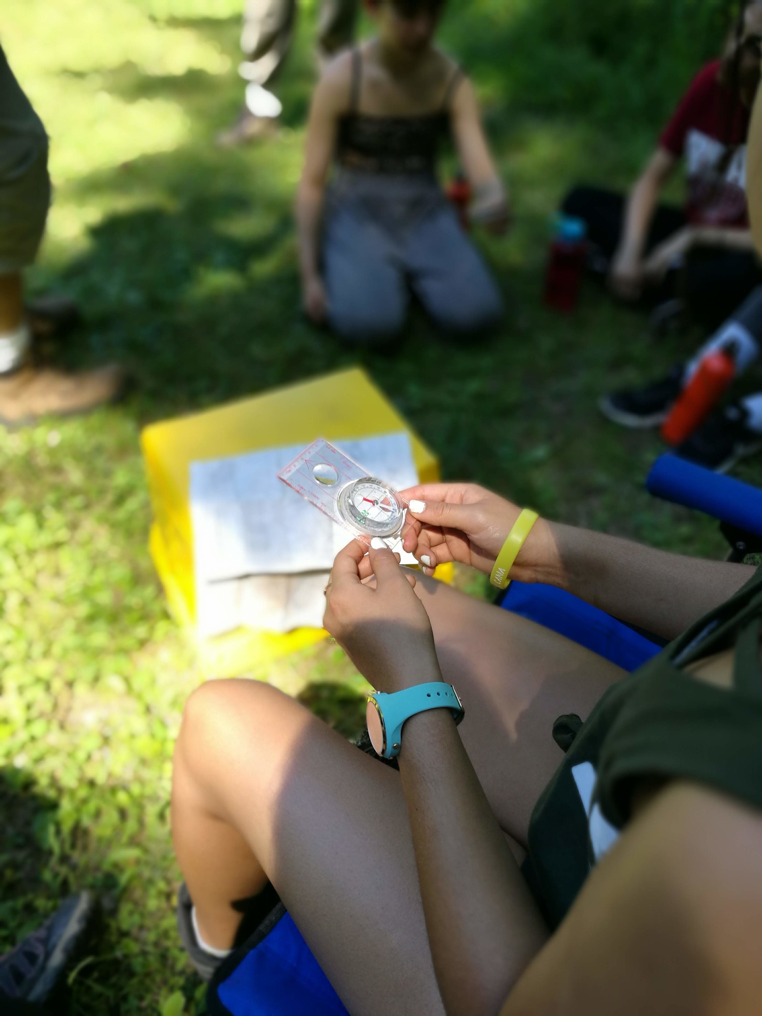  A student uses a compass to navigate 