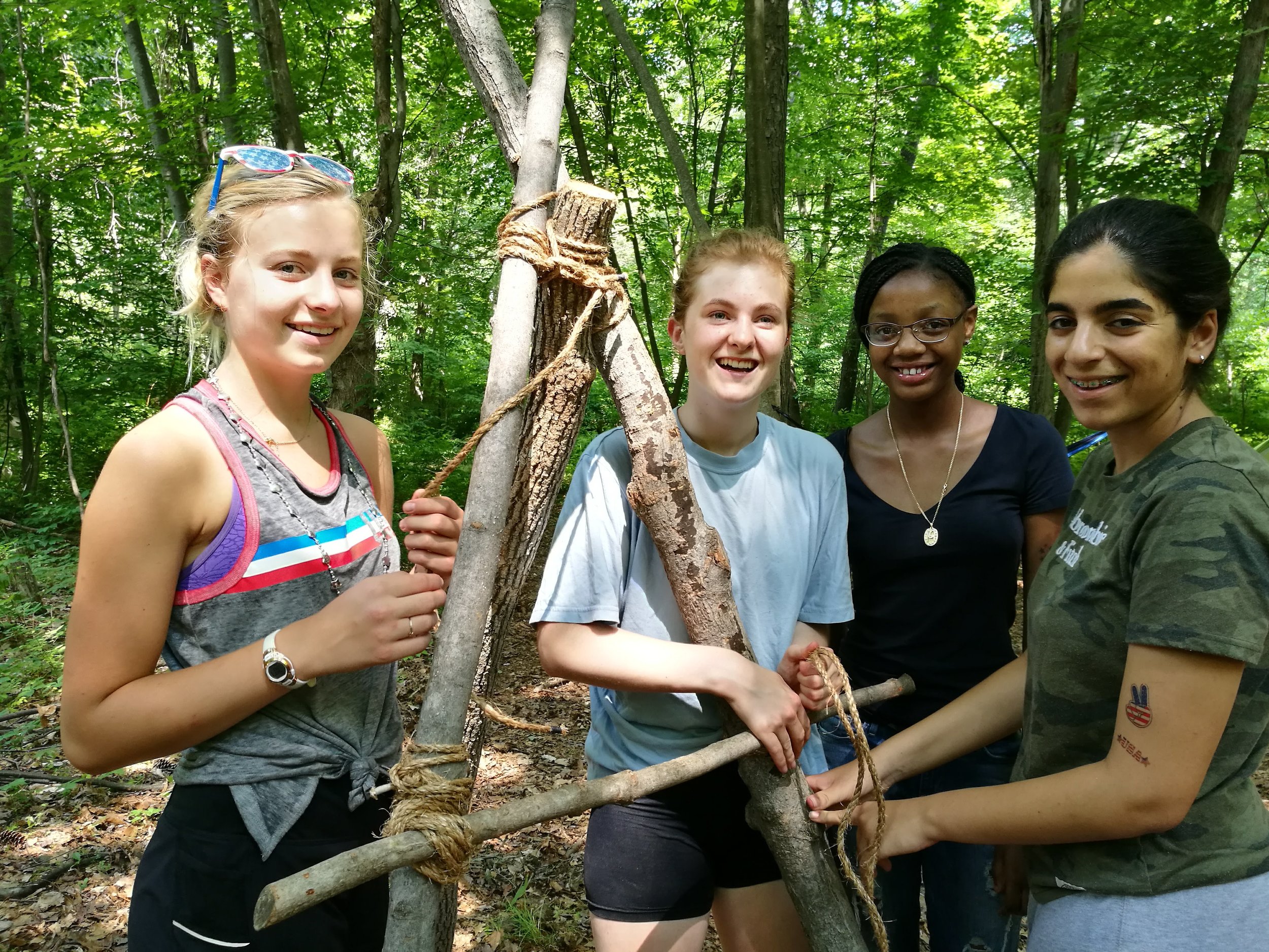  Four girls learn how to build a fire 