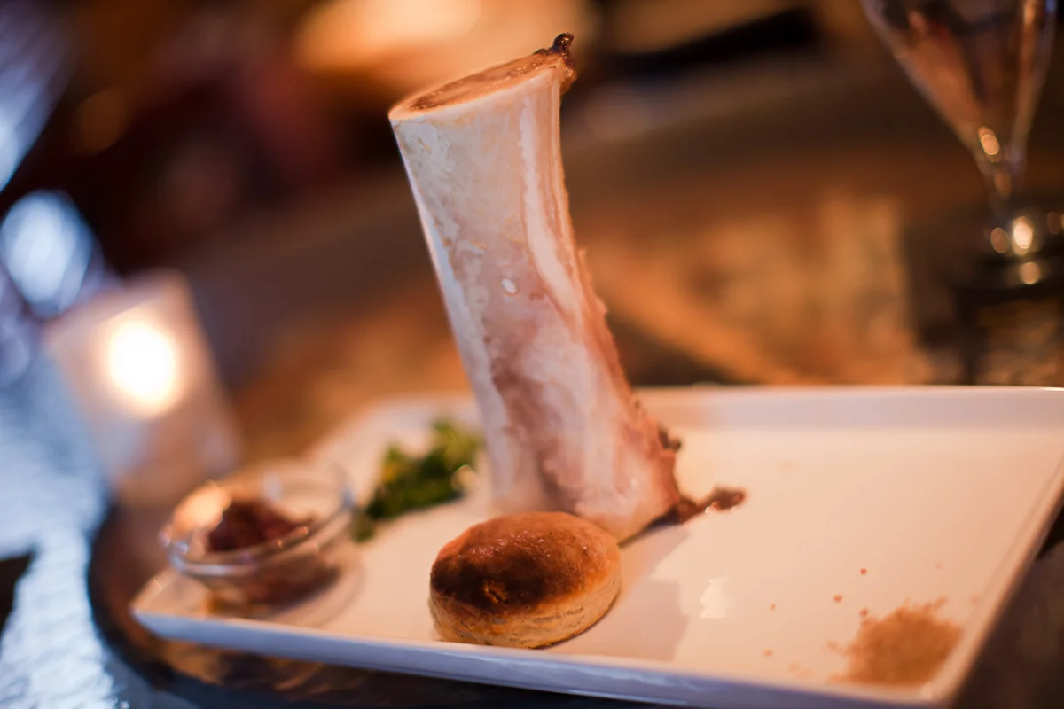 Roasted bone marrow, bourbon apple marmalade, rosemary-black pepper biscuit, parsley, lemon