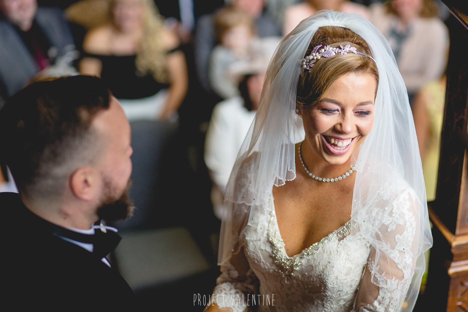 bride laughing during service