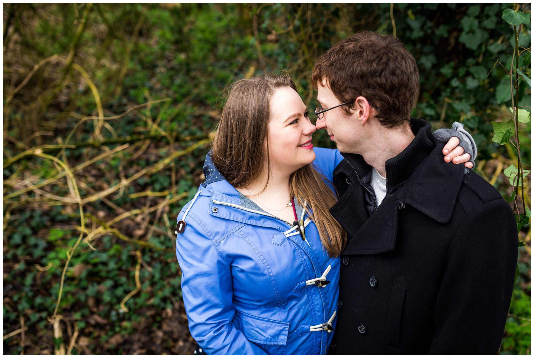 couple hugging in woodland