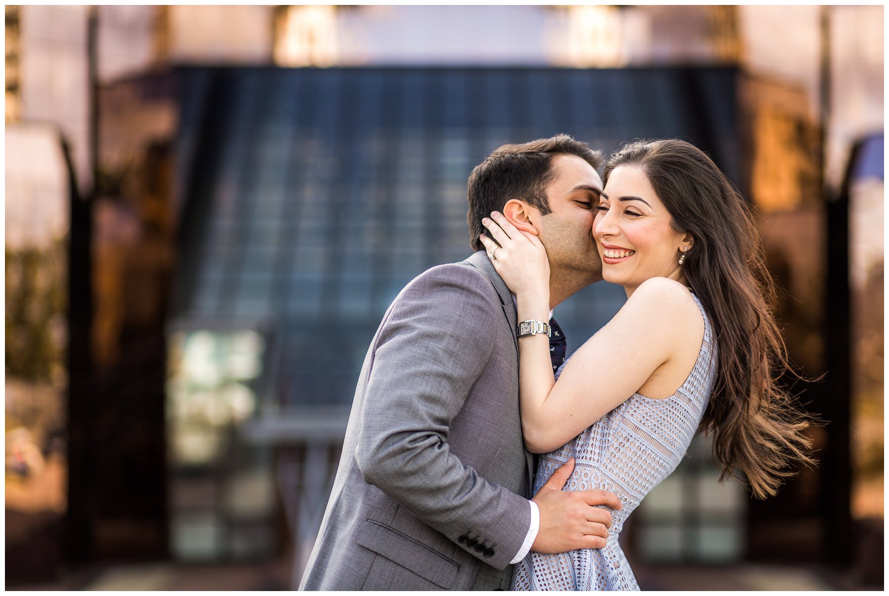 groom kissing bride on cheek