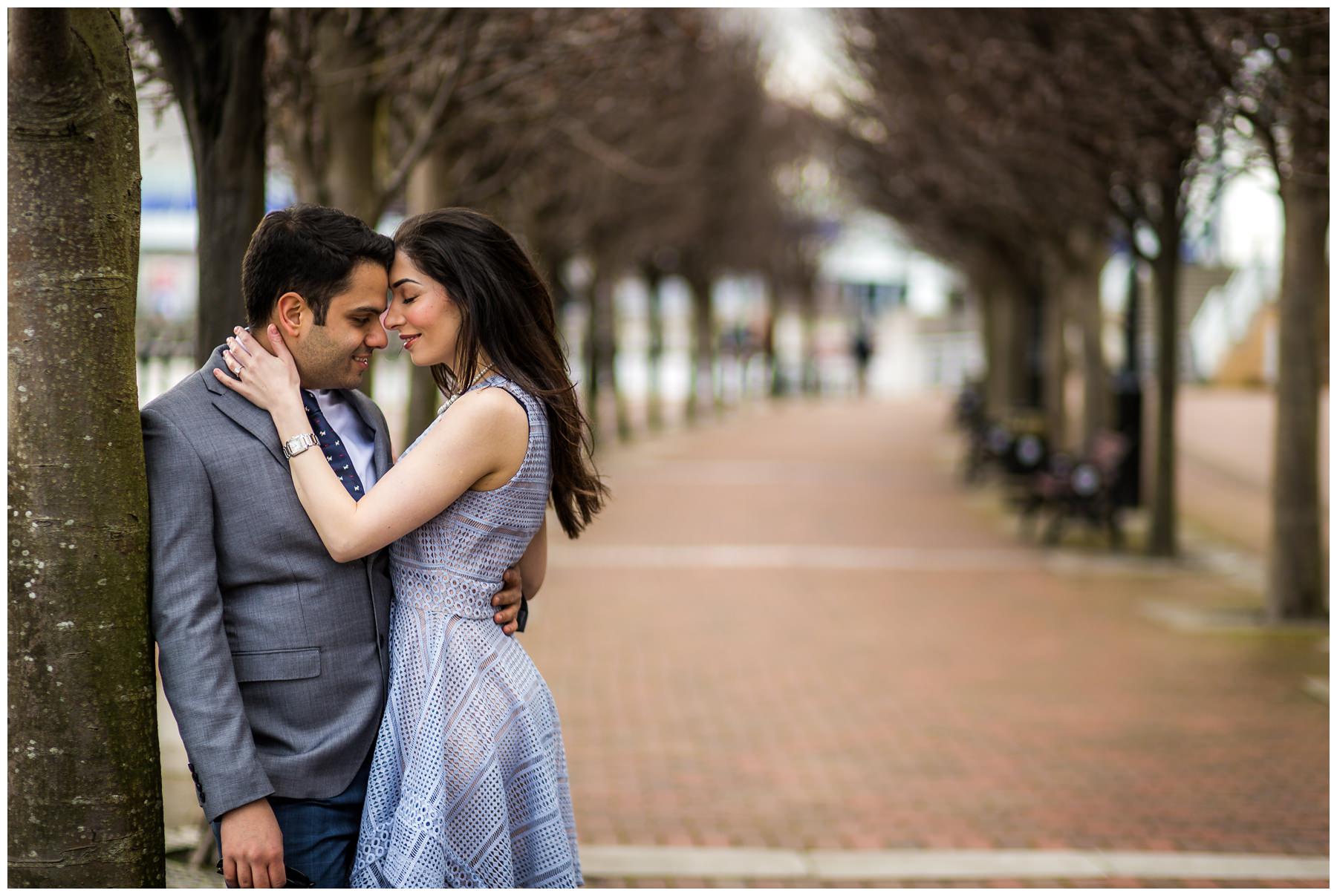 could leaning in close with a row of trees in background