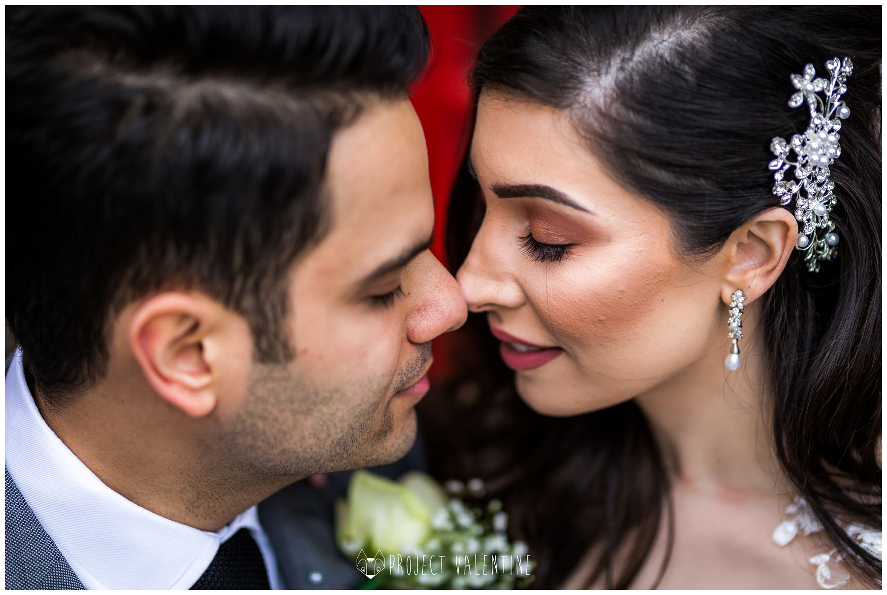 close up of bride and groom nose to nose