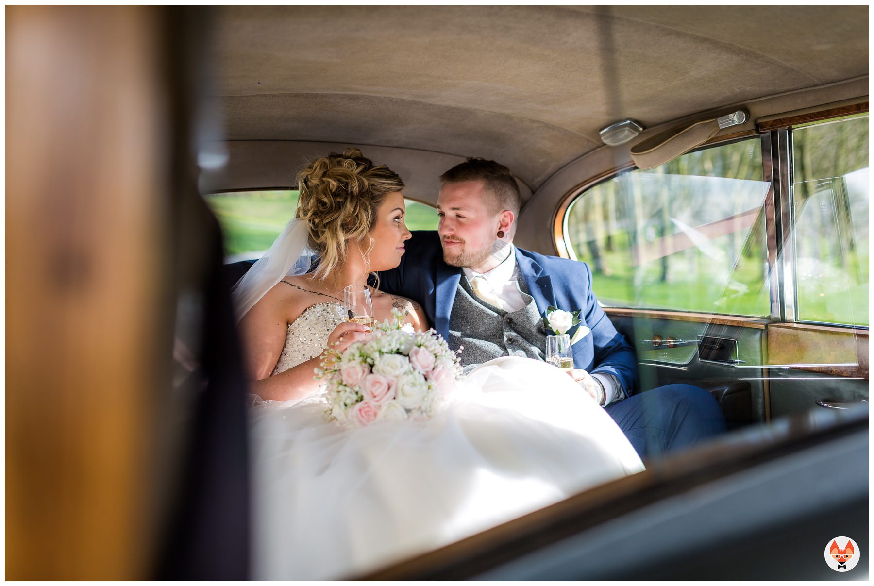 bride and groom in wedding car