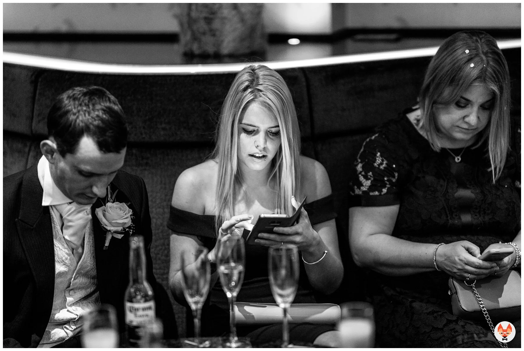 wedding guest on their phone