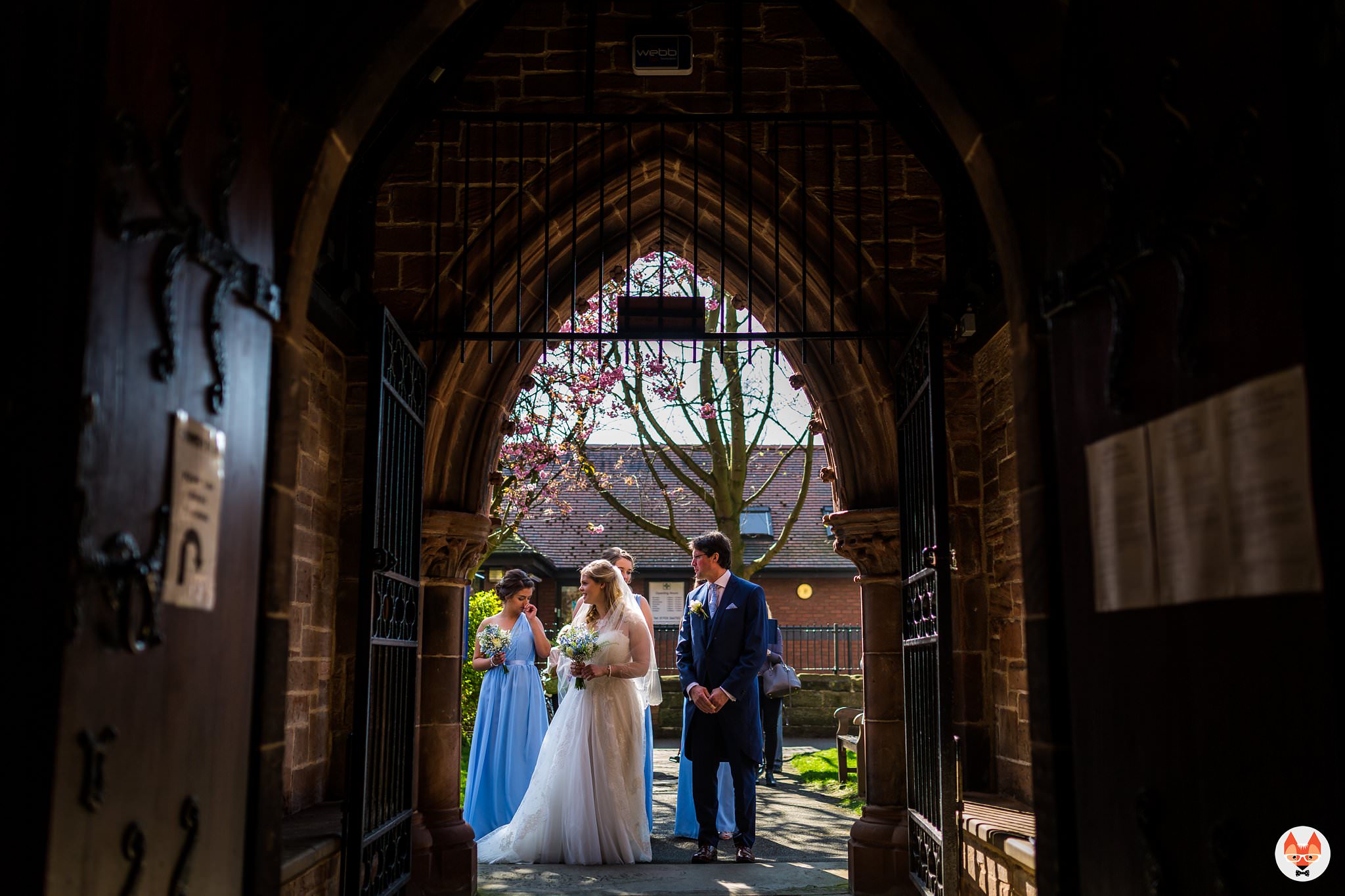 bride in archway to church