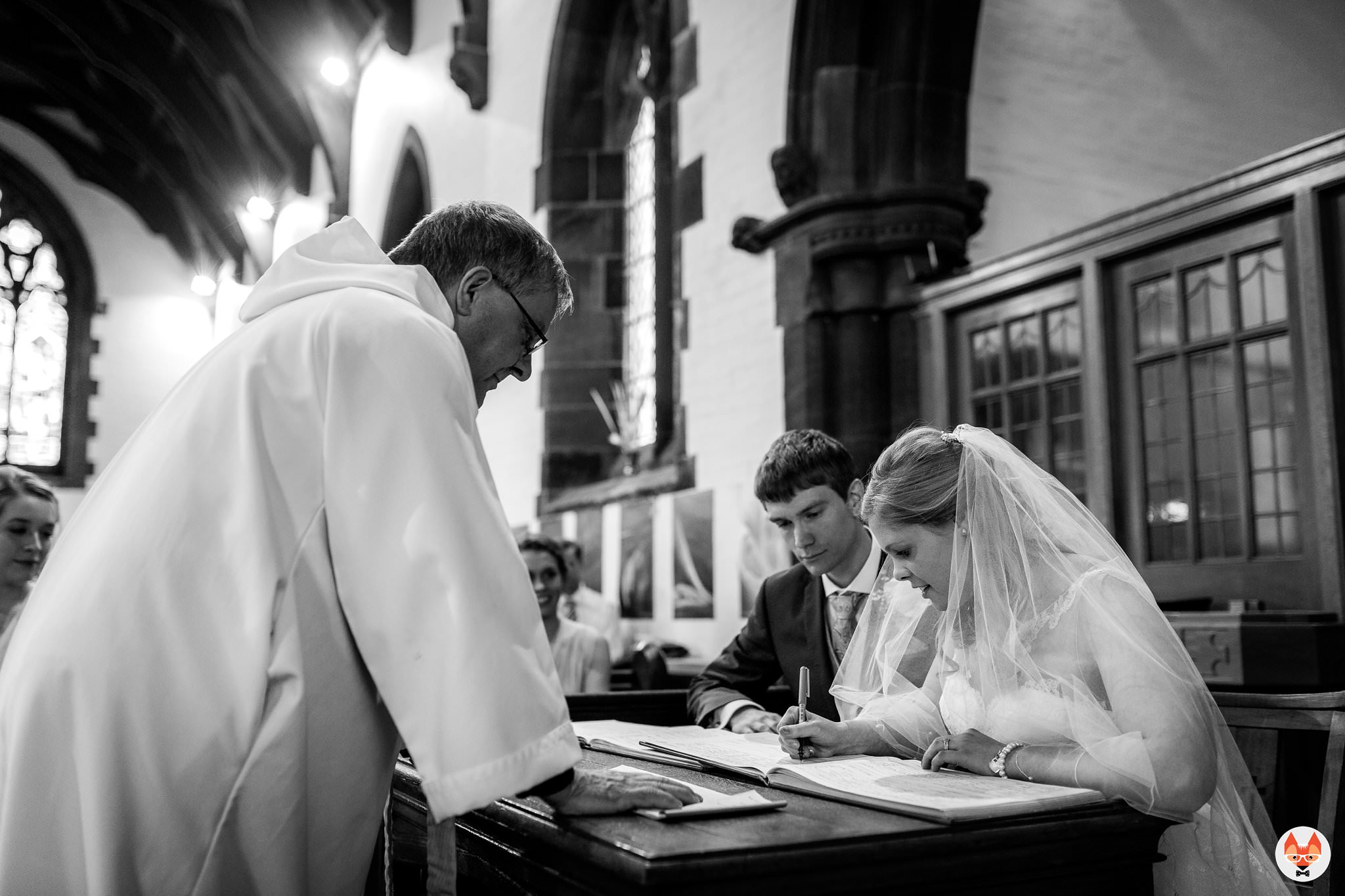 bride signing the register 