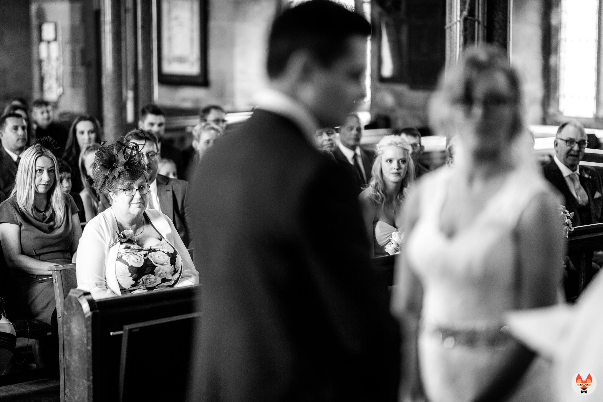 brides mum watching on during the service