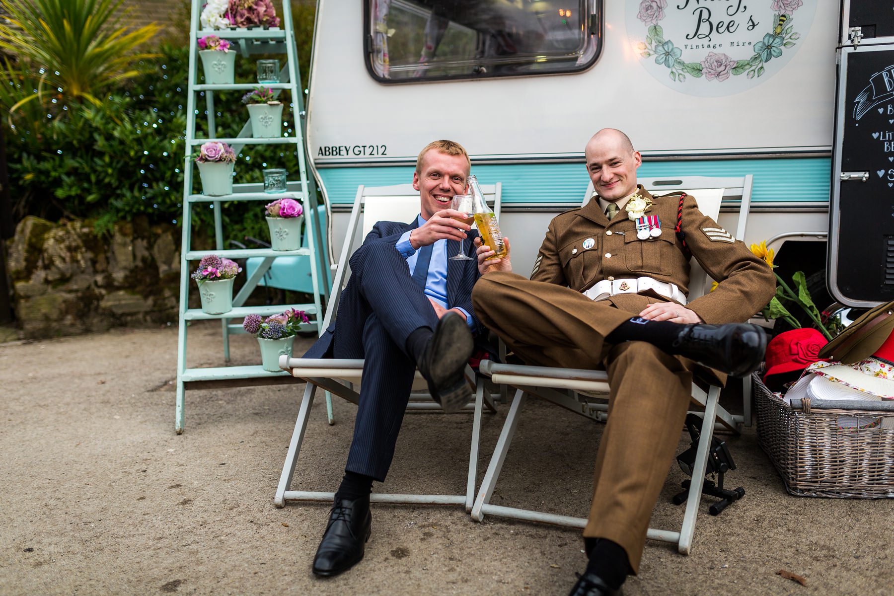 groom sat outside photo booth