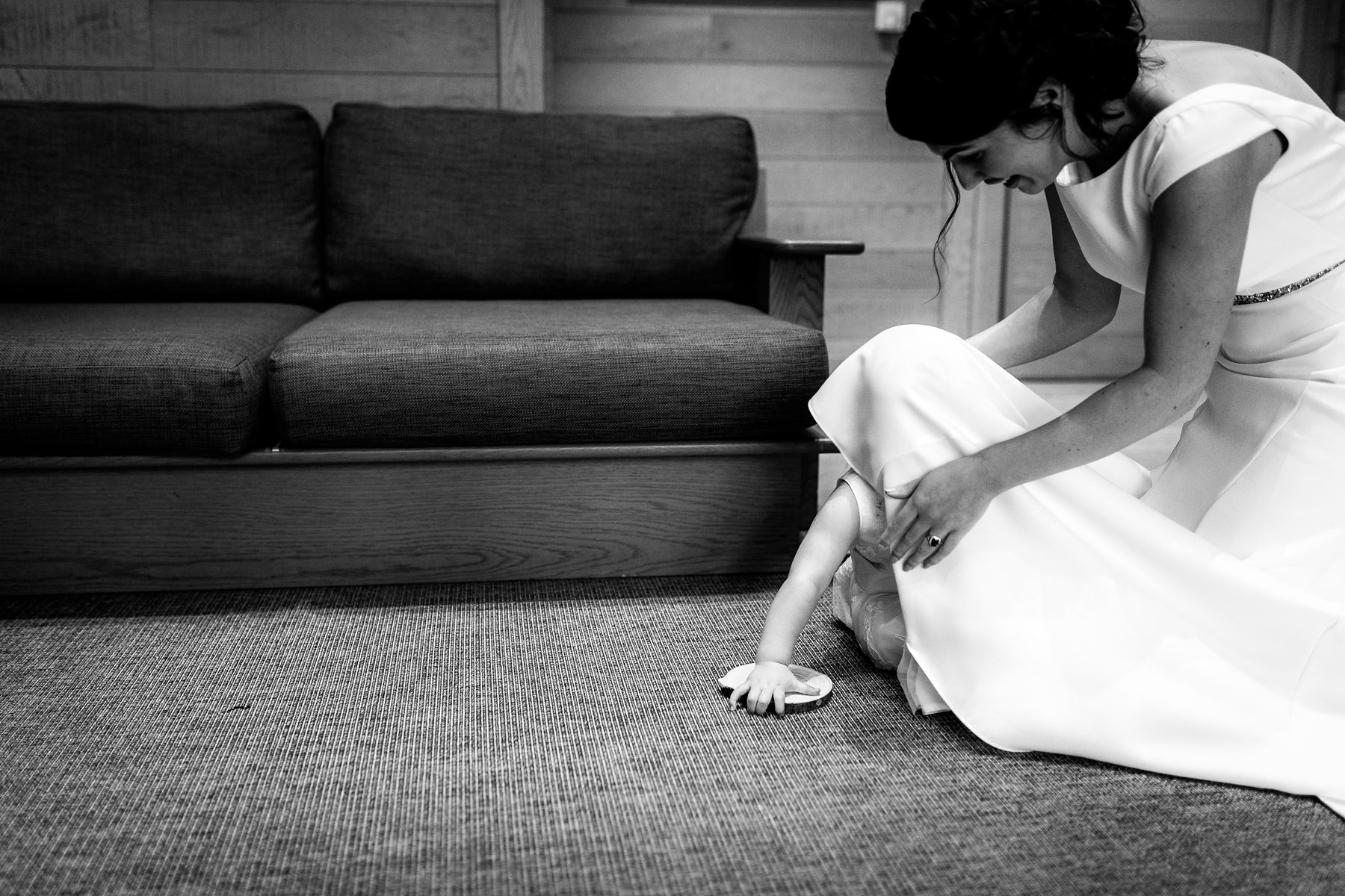 bride playing with flowergirl