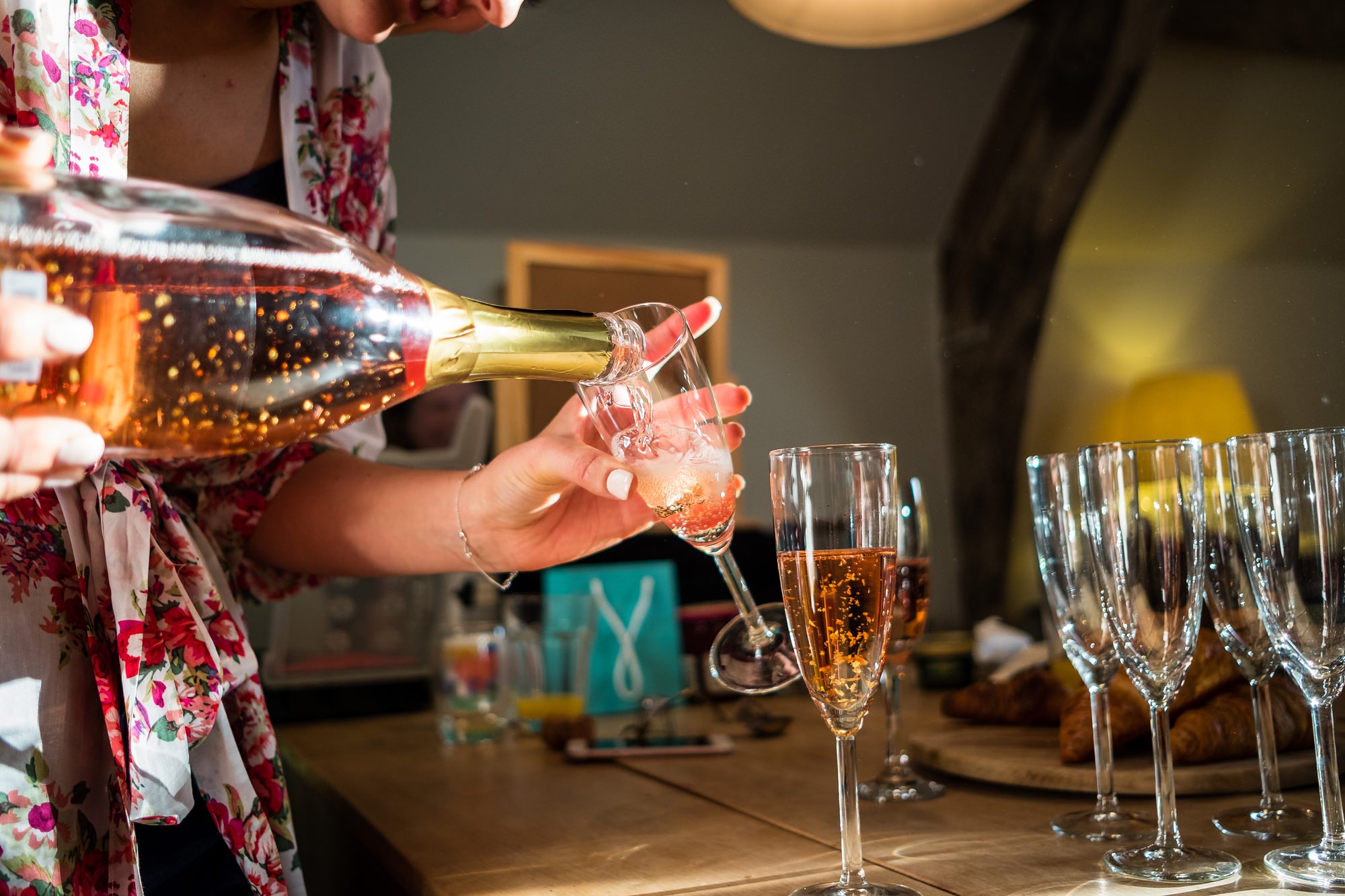 bride pouring wedding drinks