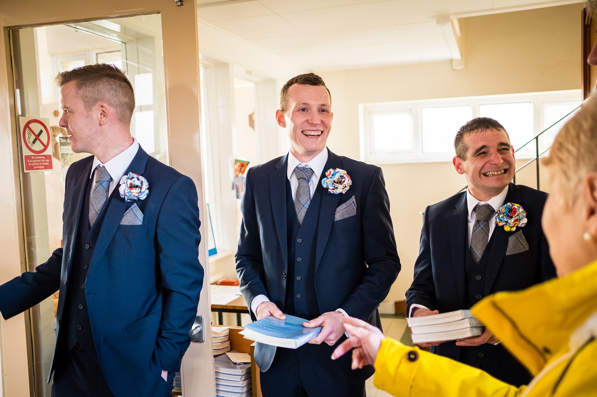 groomsmen greeting wedding guests