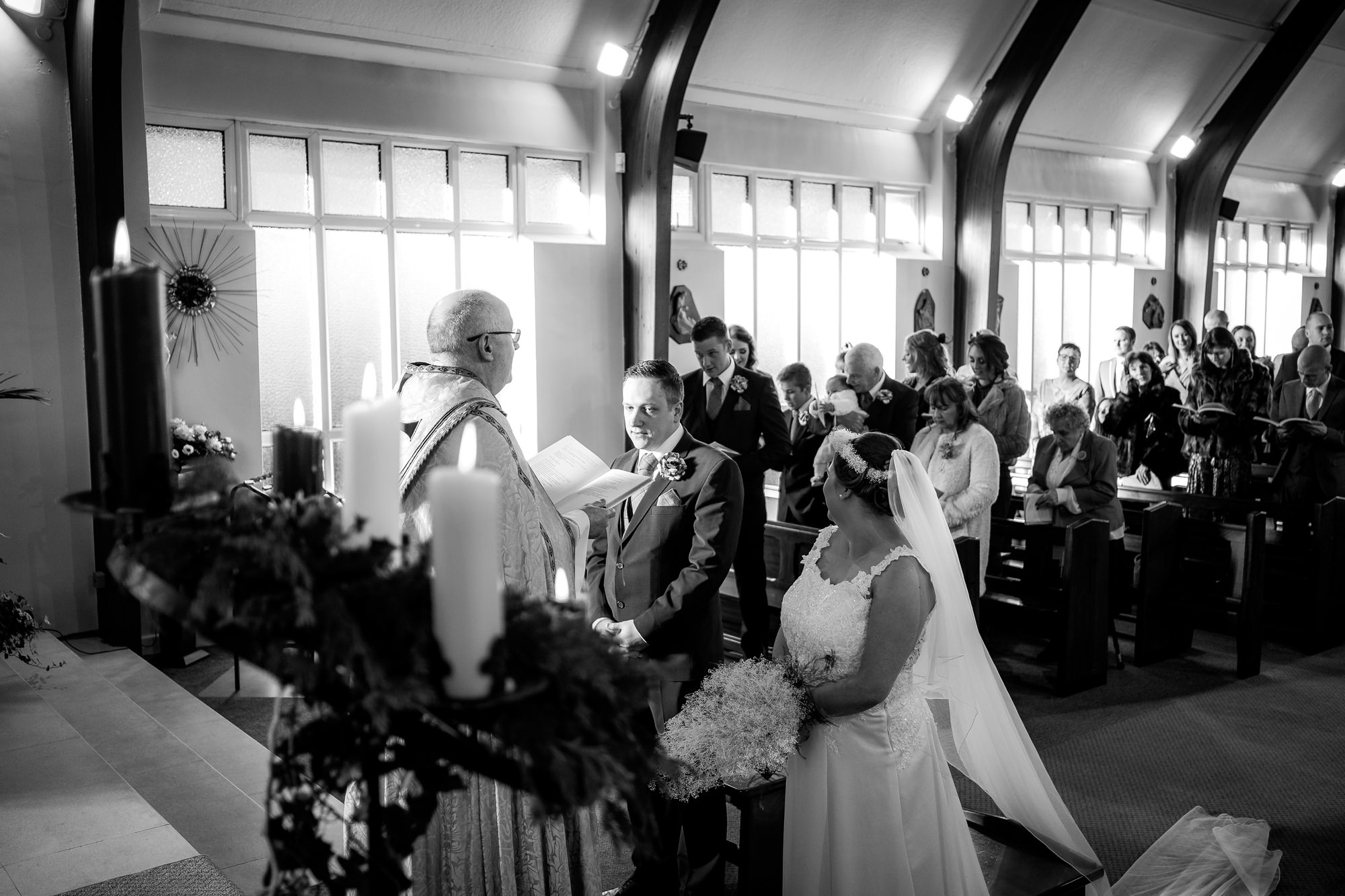 bride greets groom at the end of the aisle