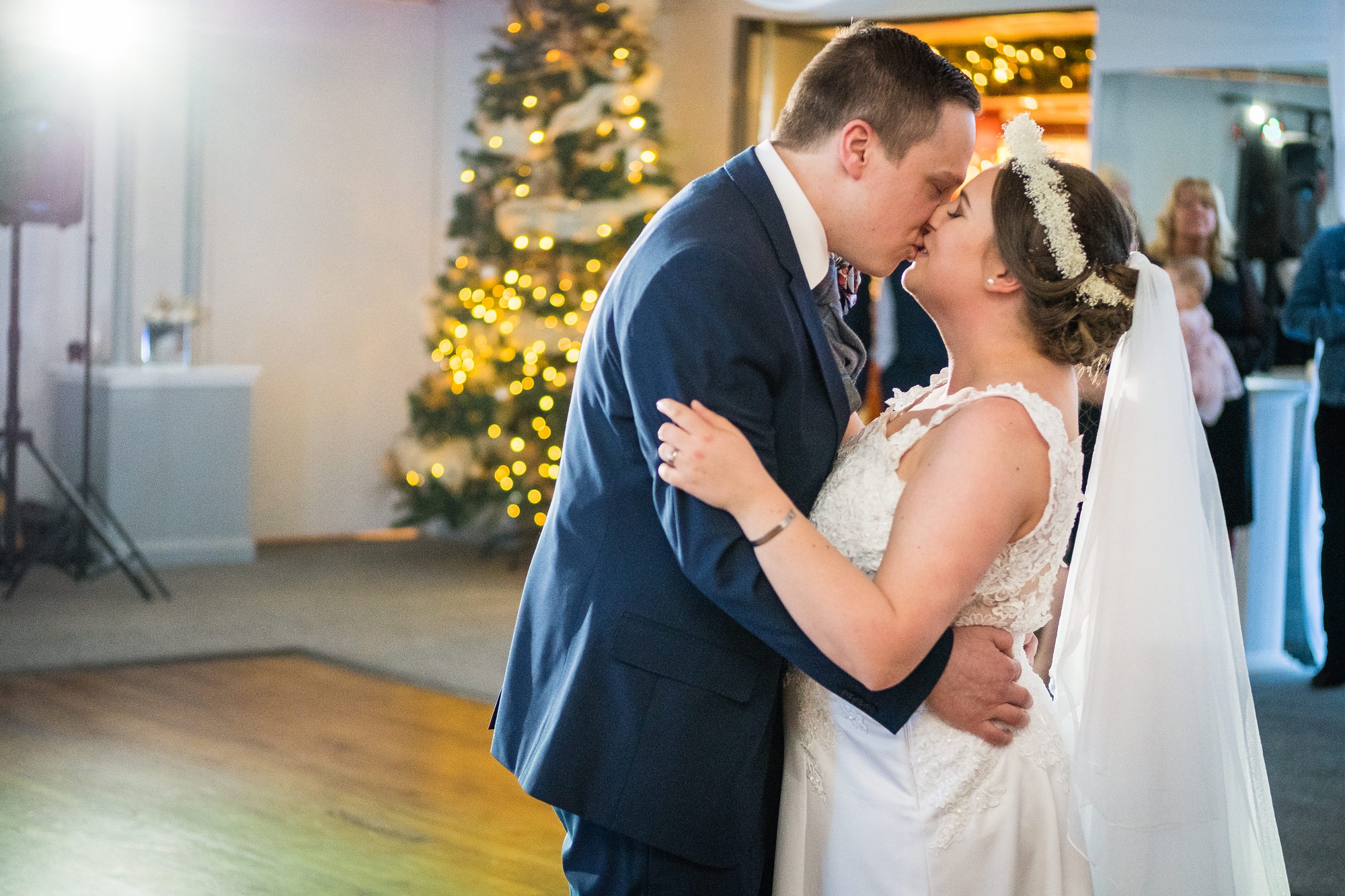 bride and groom kiss during first dance