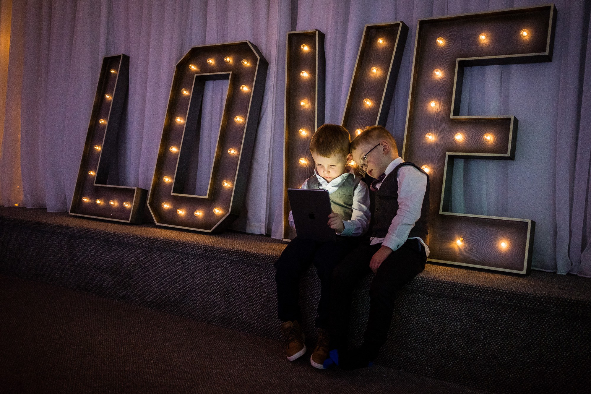 children sat in front of love letters