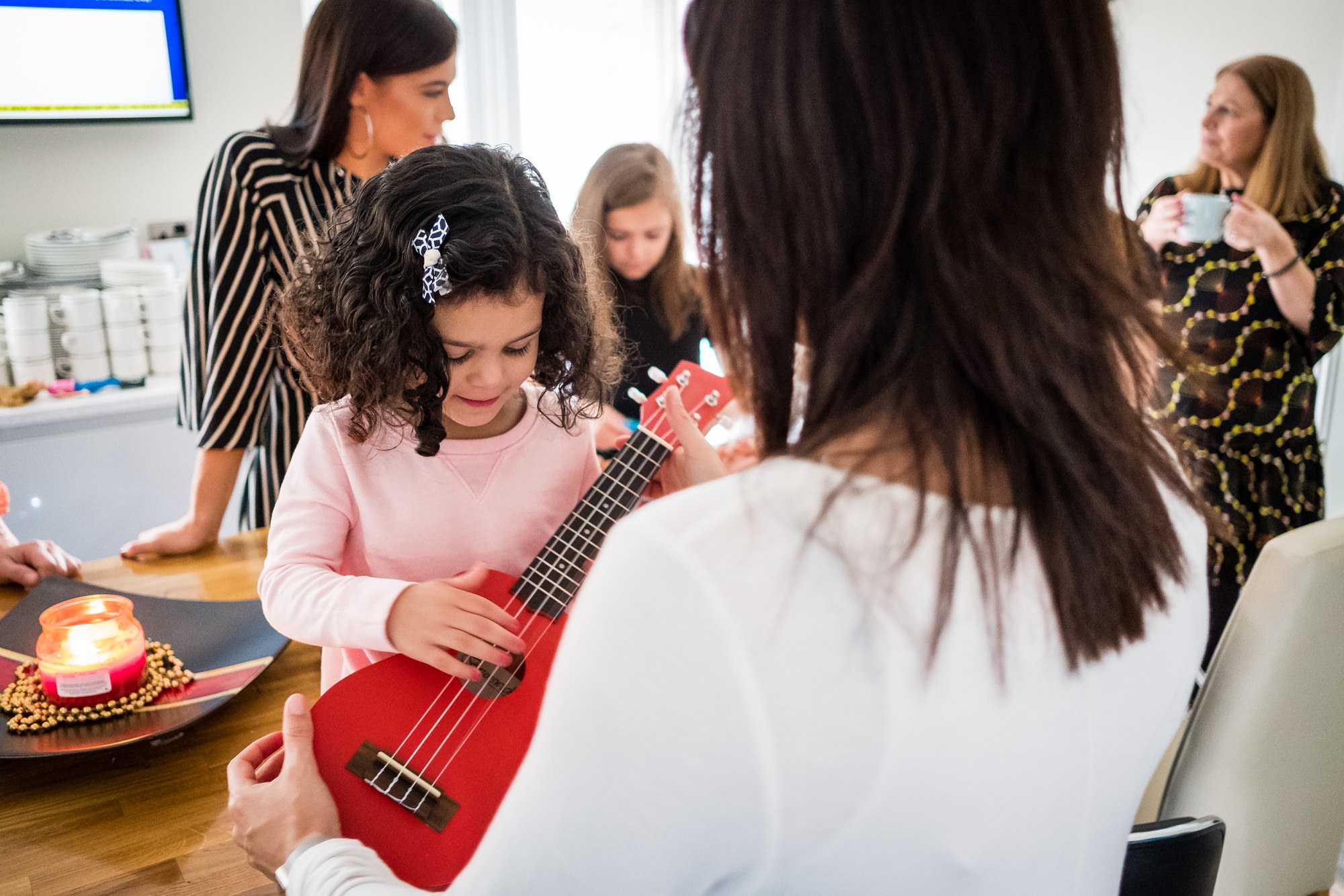 little girl playing guitar