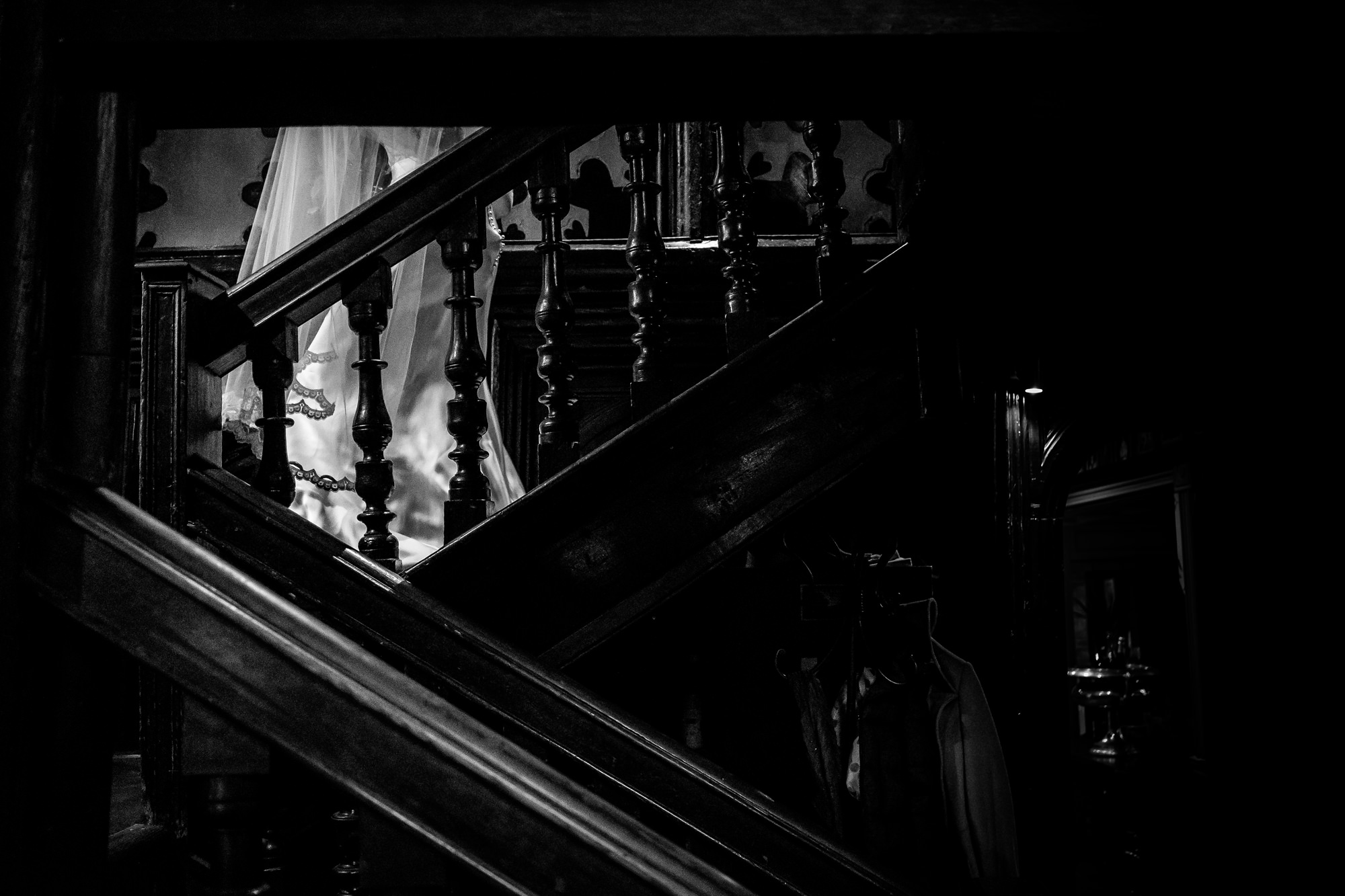 bride walking down the stairs at mitton hall