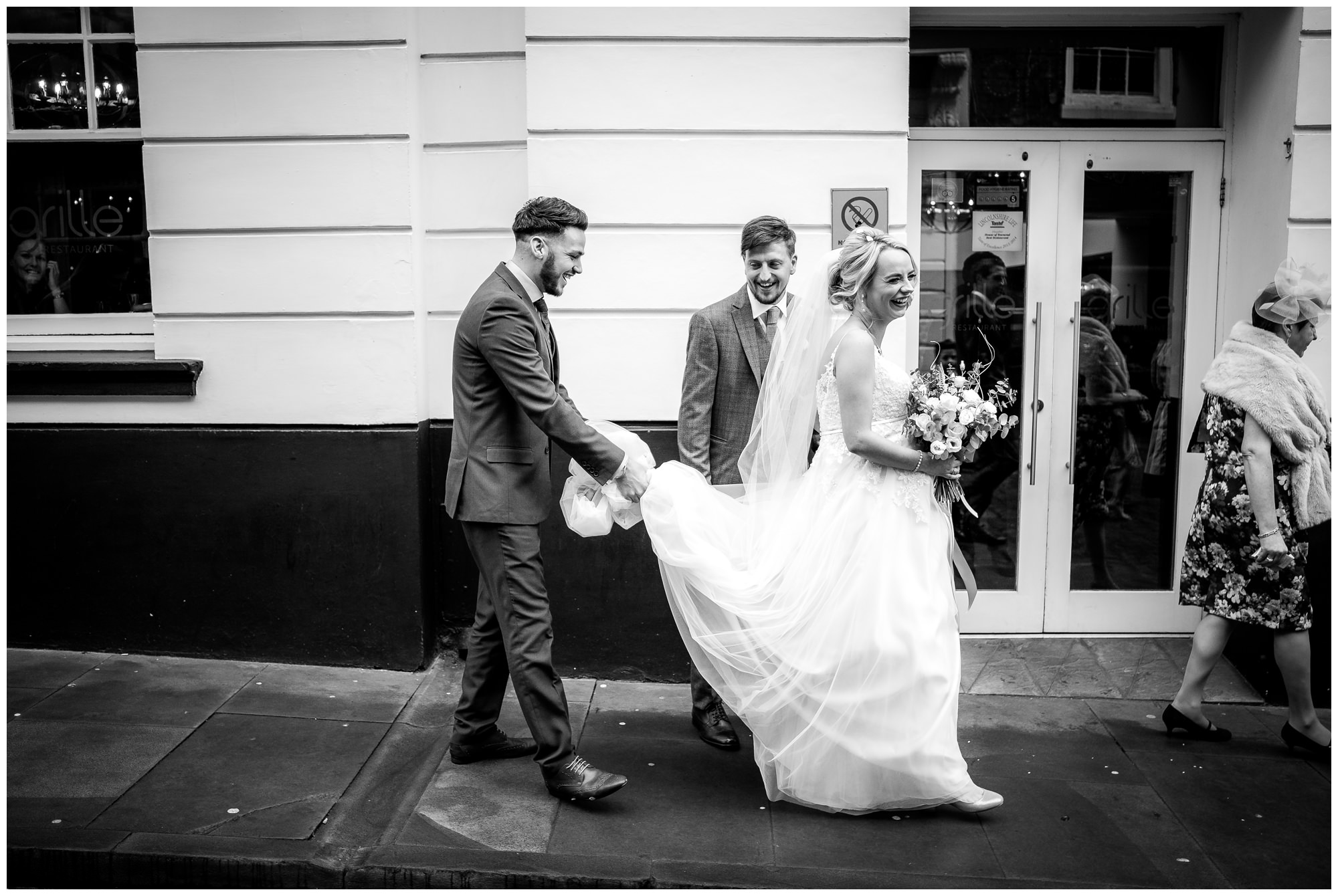 wedding guest carrying dress