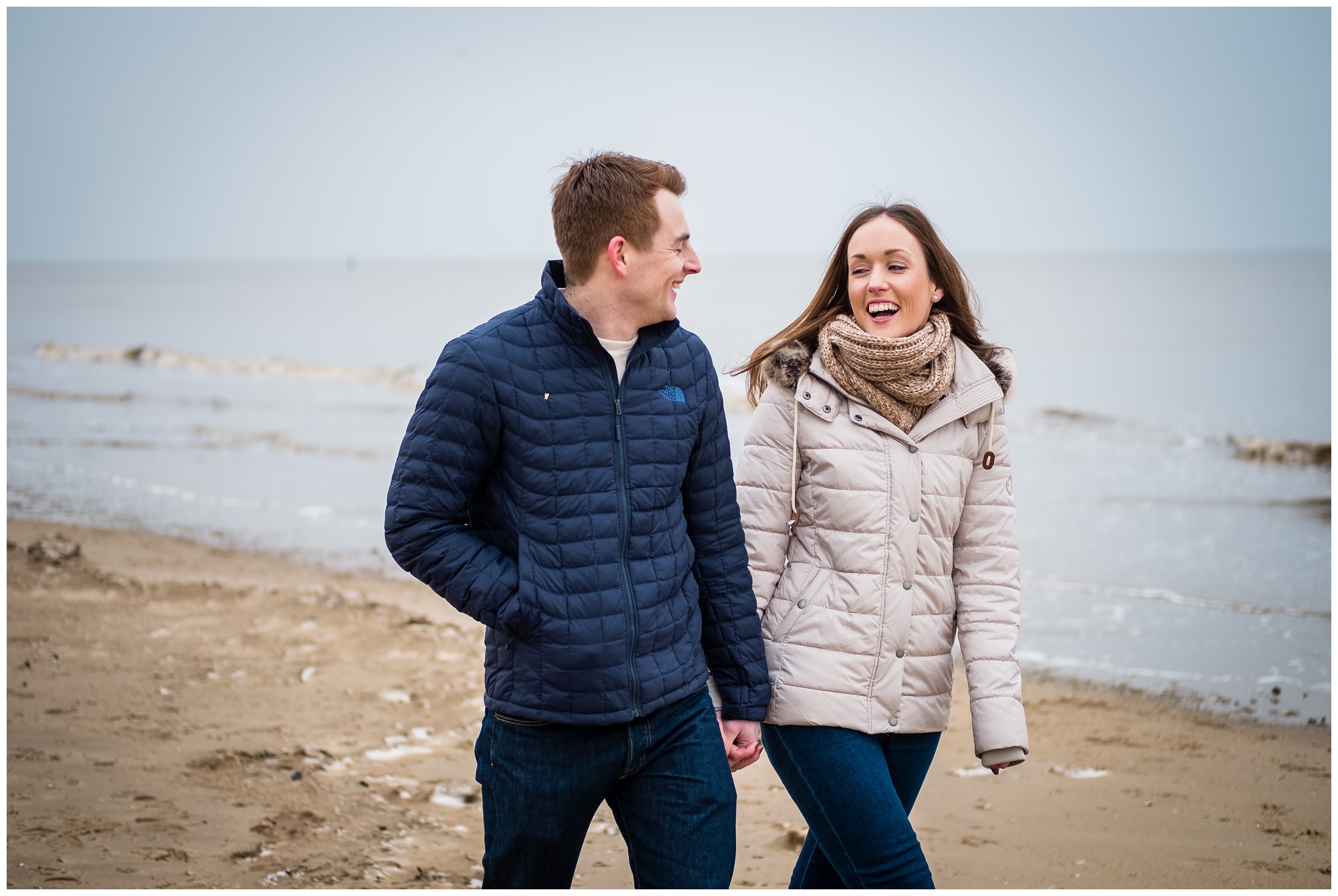 bride to be laughing on beach