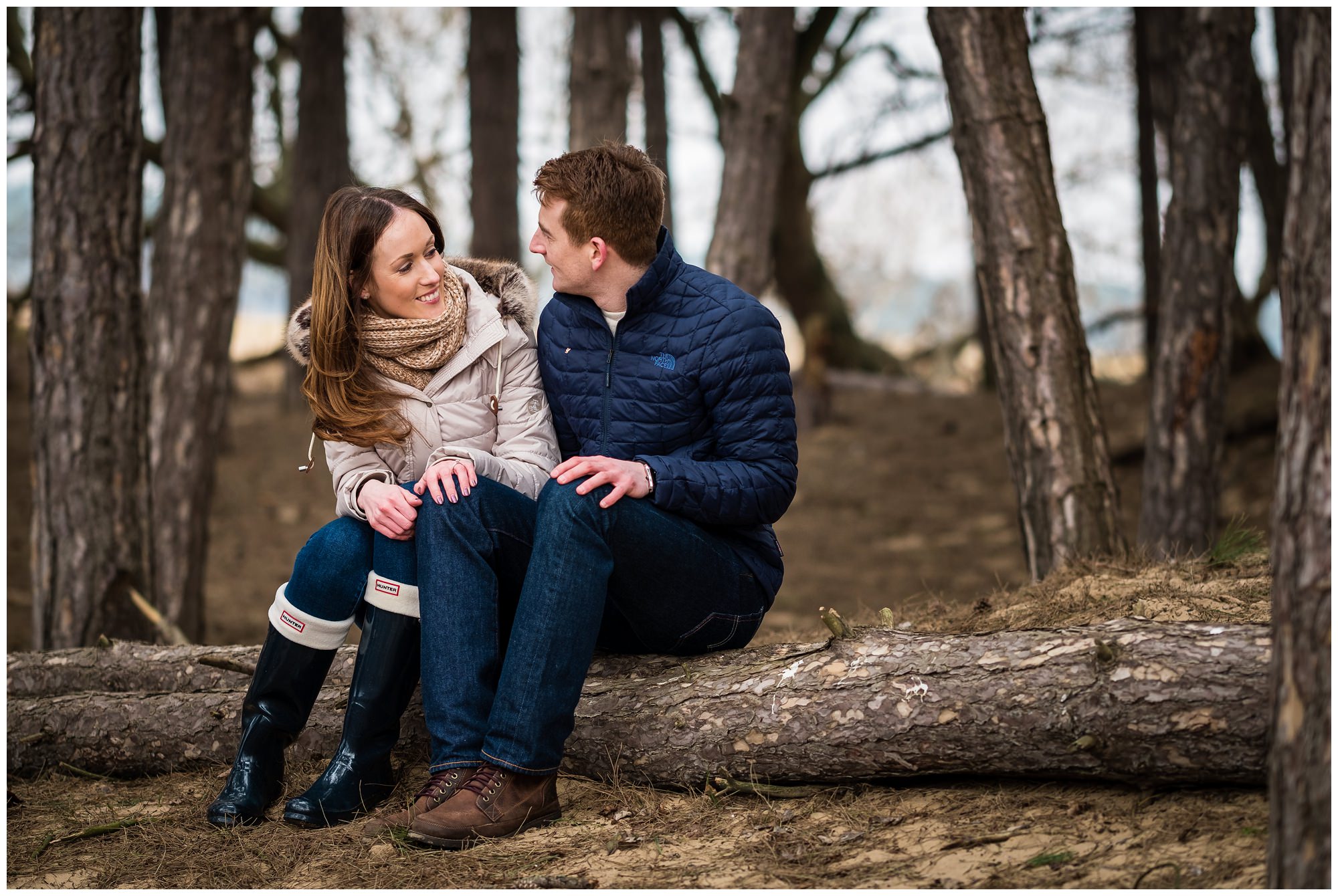 couple sat on log