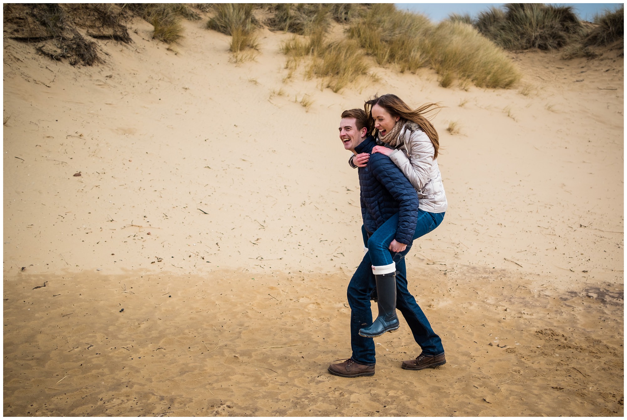 fiancé running on sand