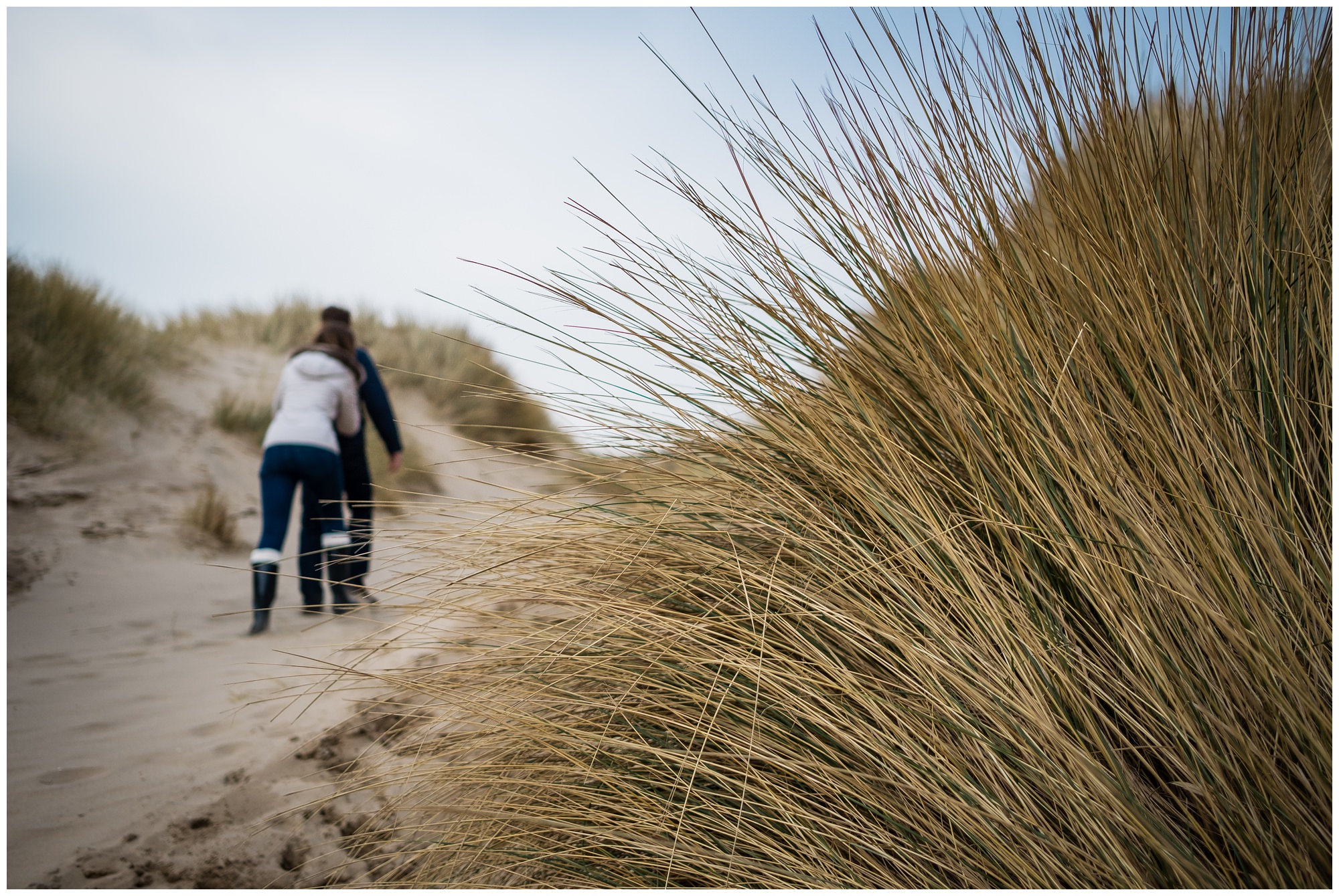 couple leaving the beach