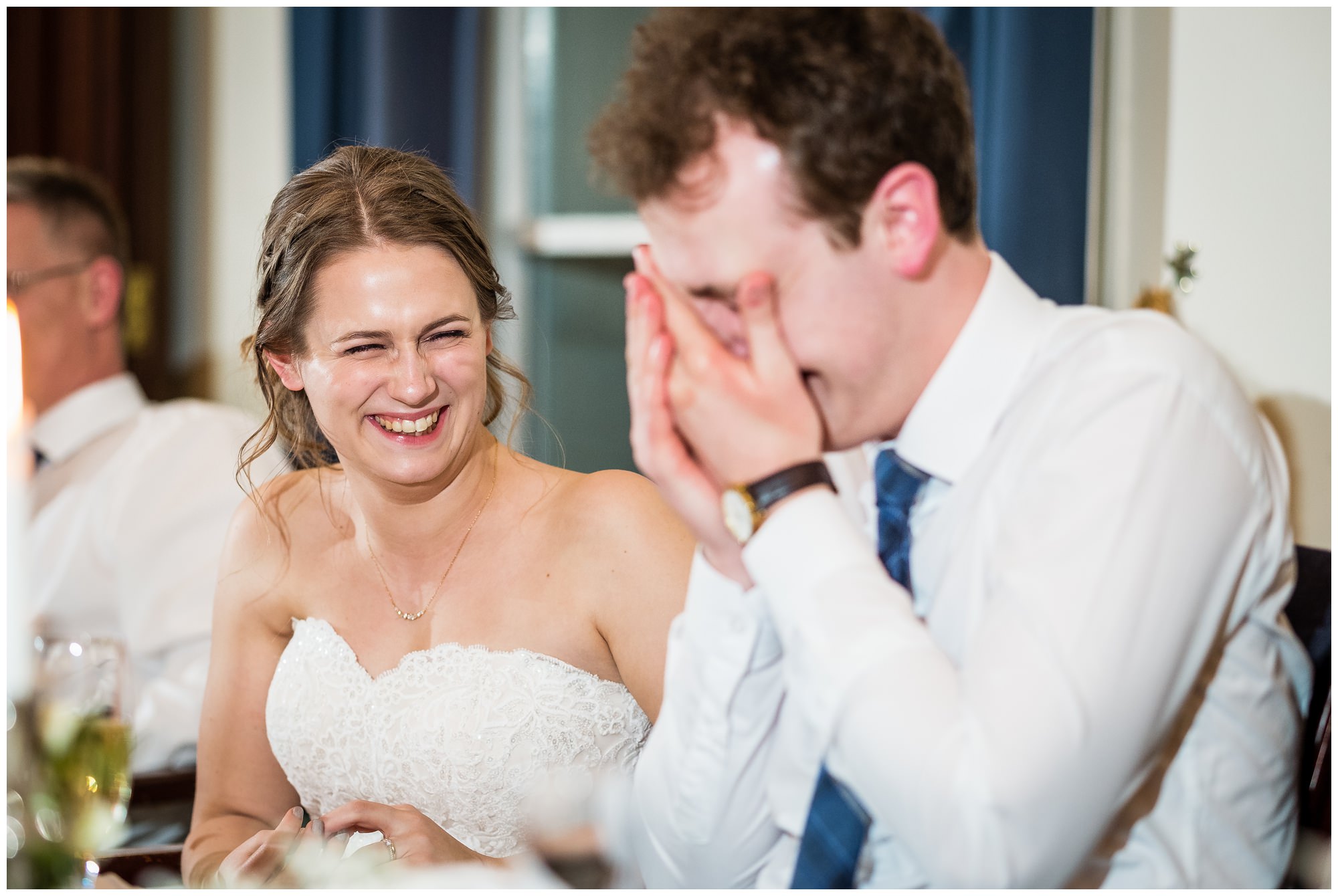 groom hiding his face during speeches