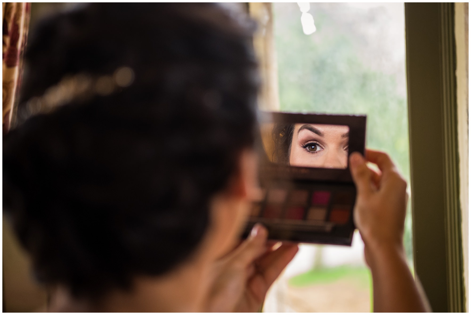 bride looking in mirror