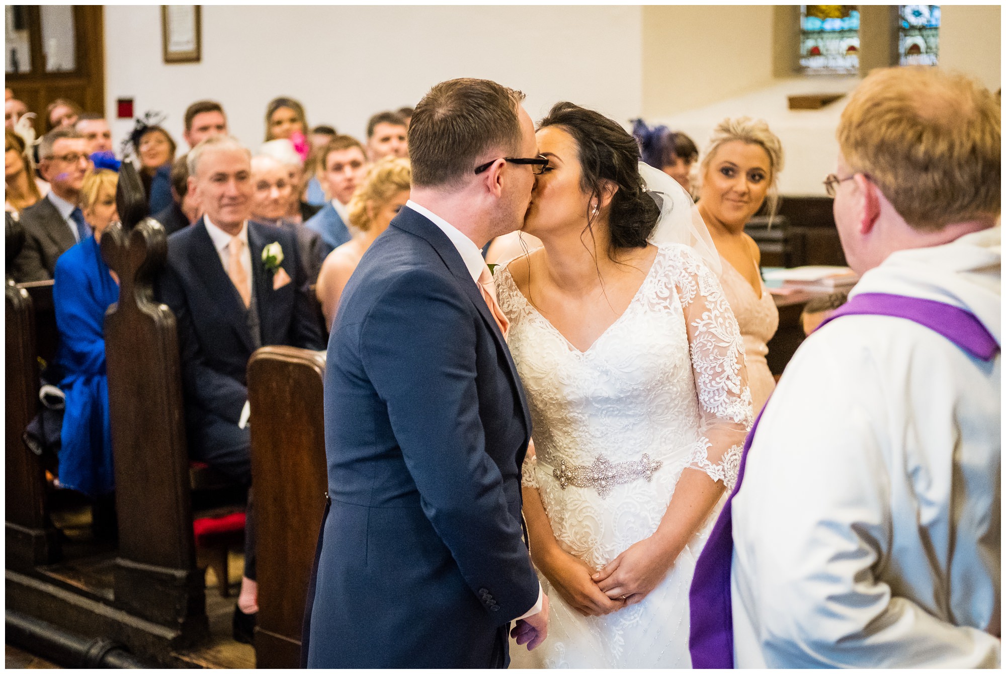 bride and groom first kiss