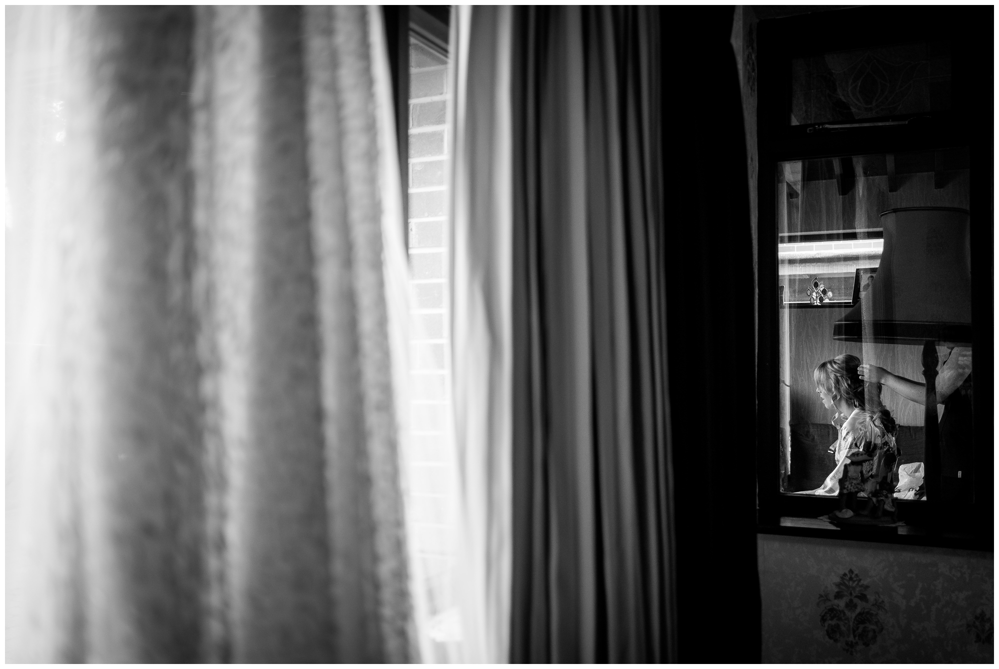 bride getting ready through window