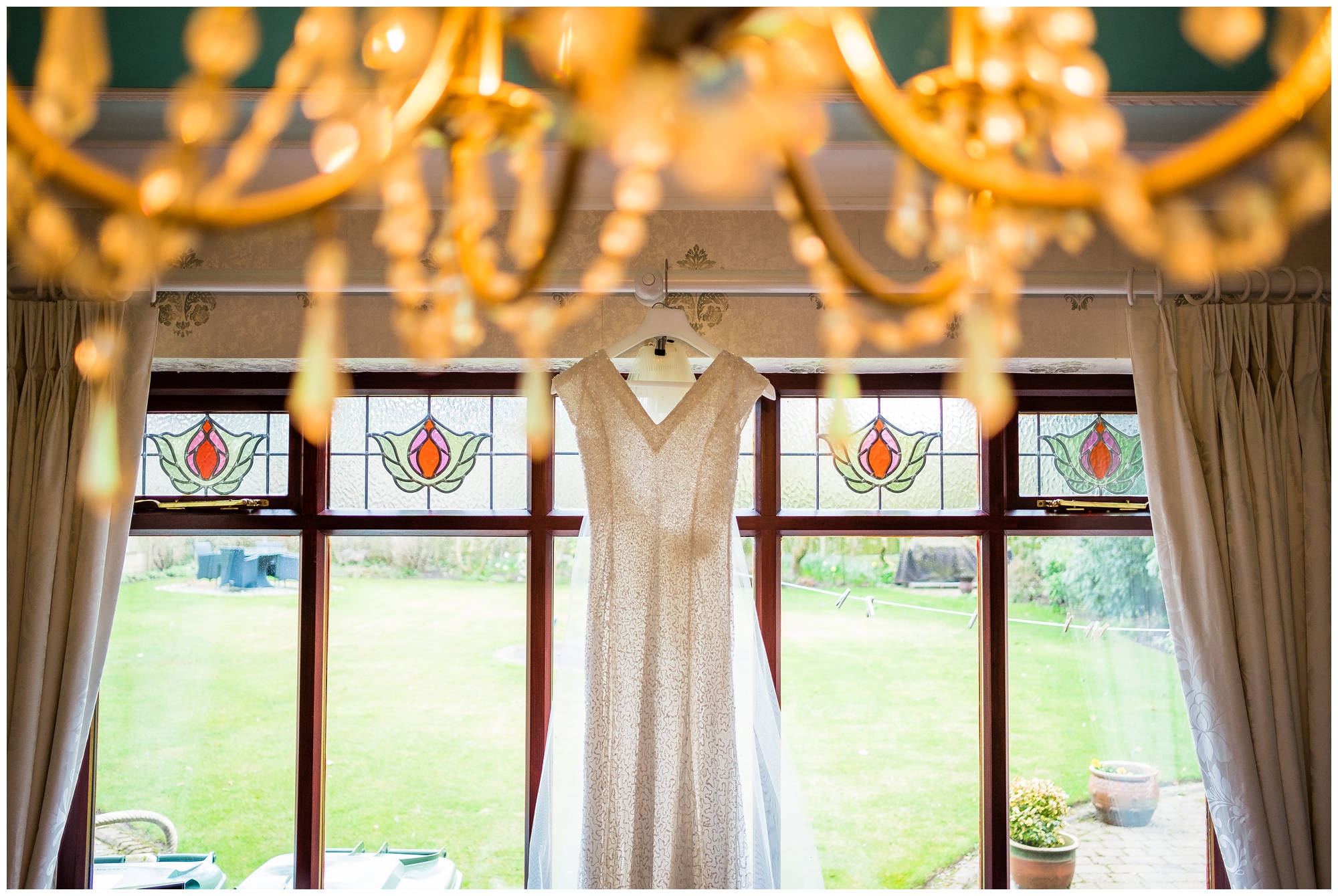 wedding dress hung in window