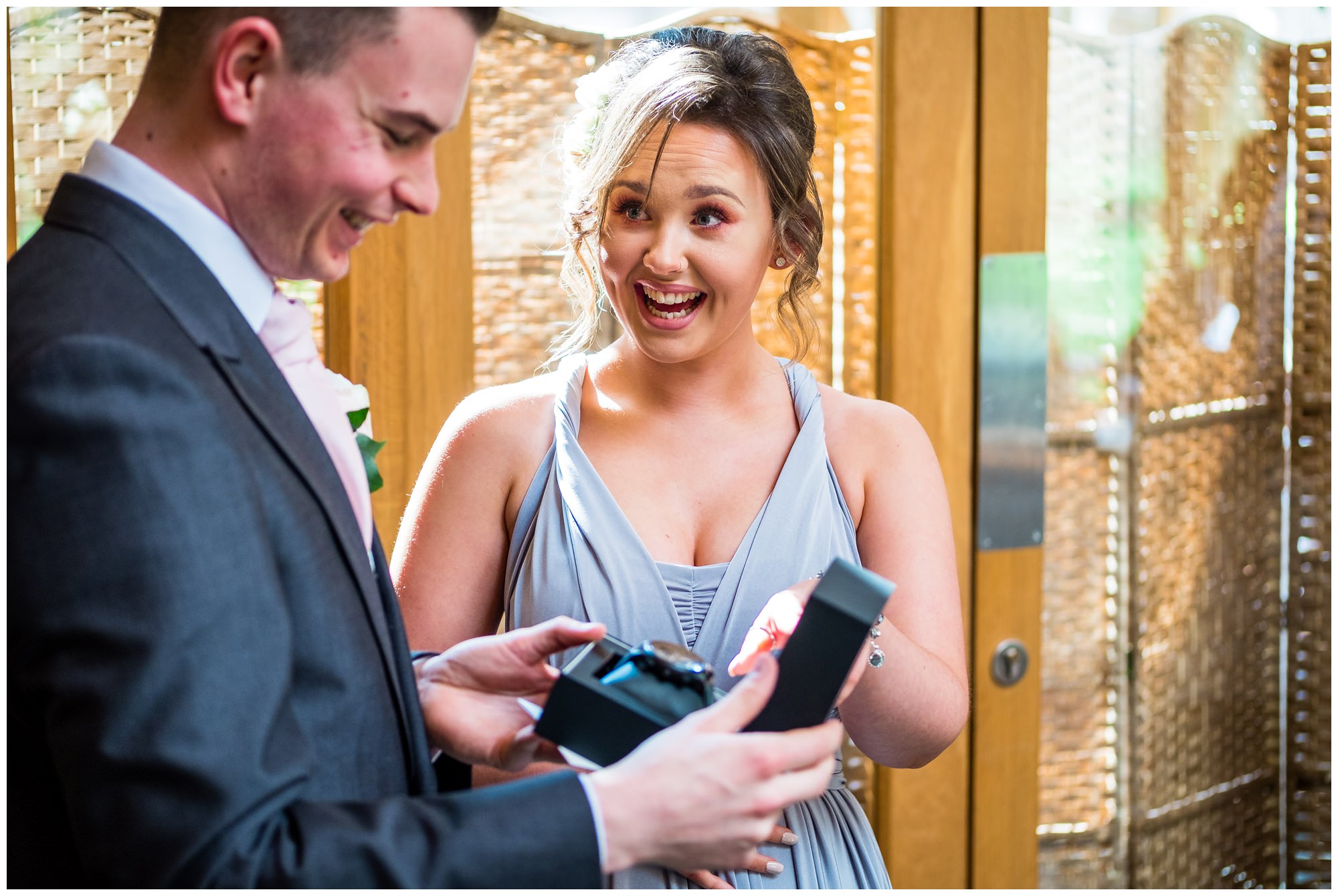 groom receiving wedding gift