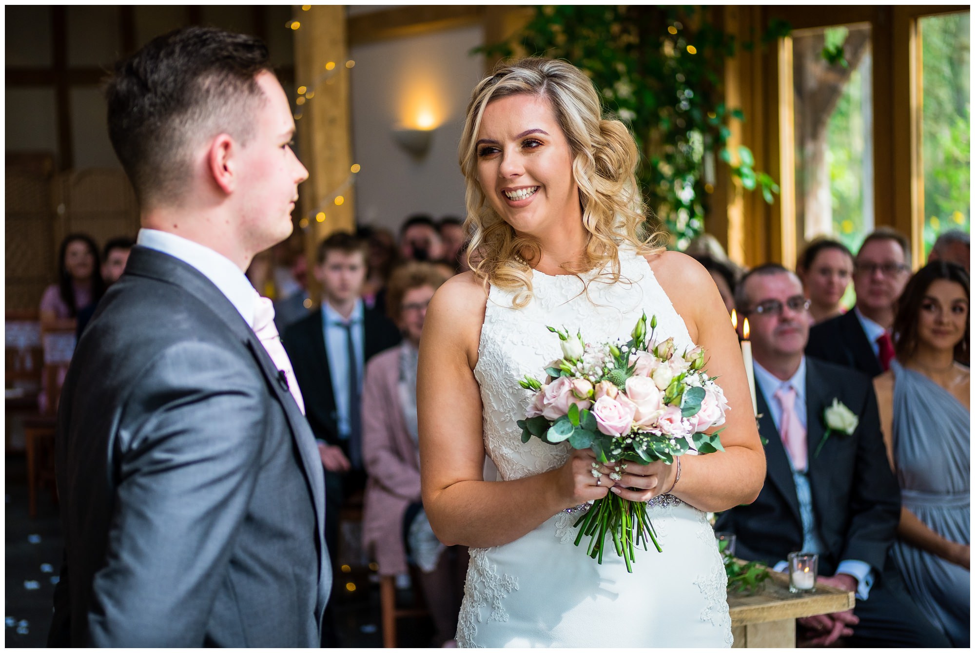 bride smiling during service