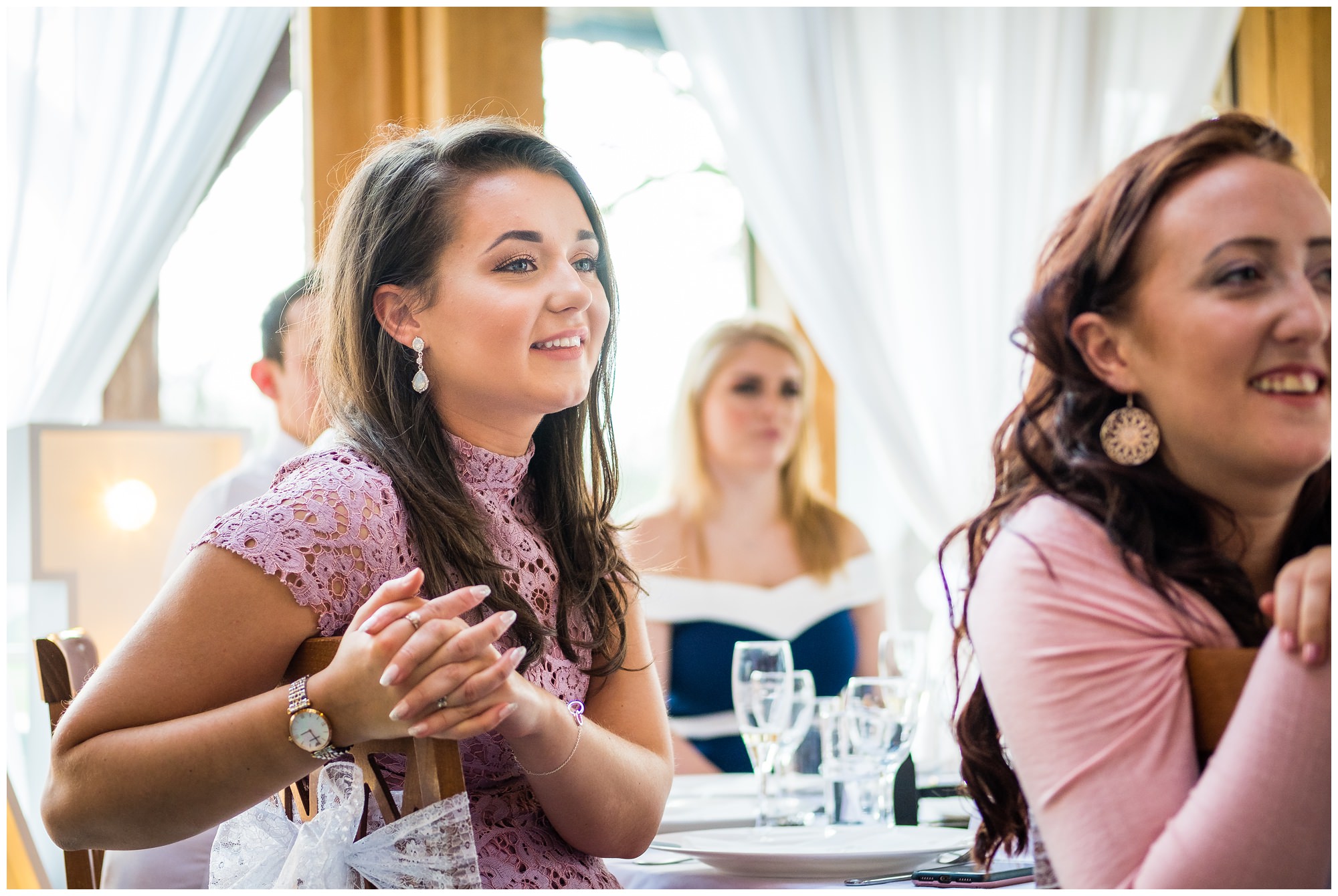 guest smiling during speeches