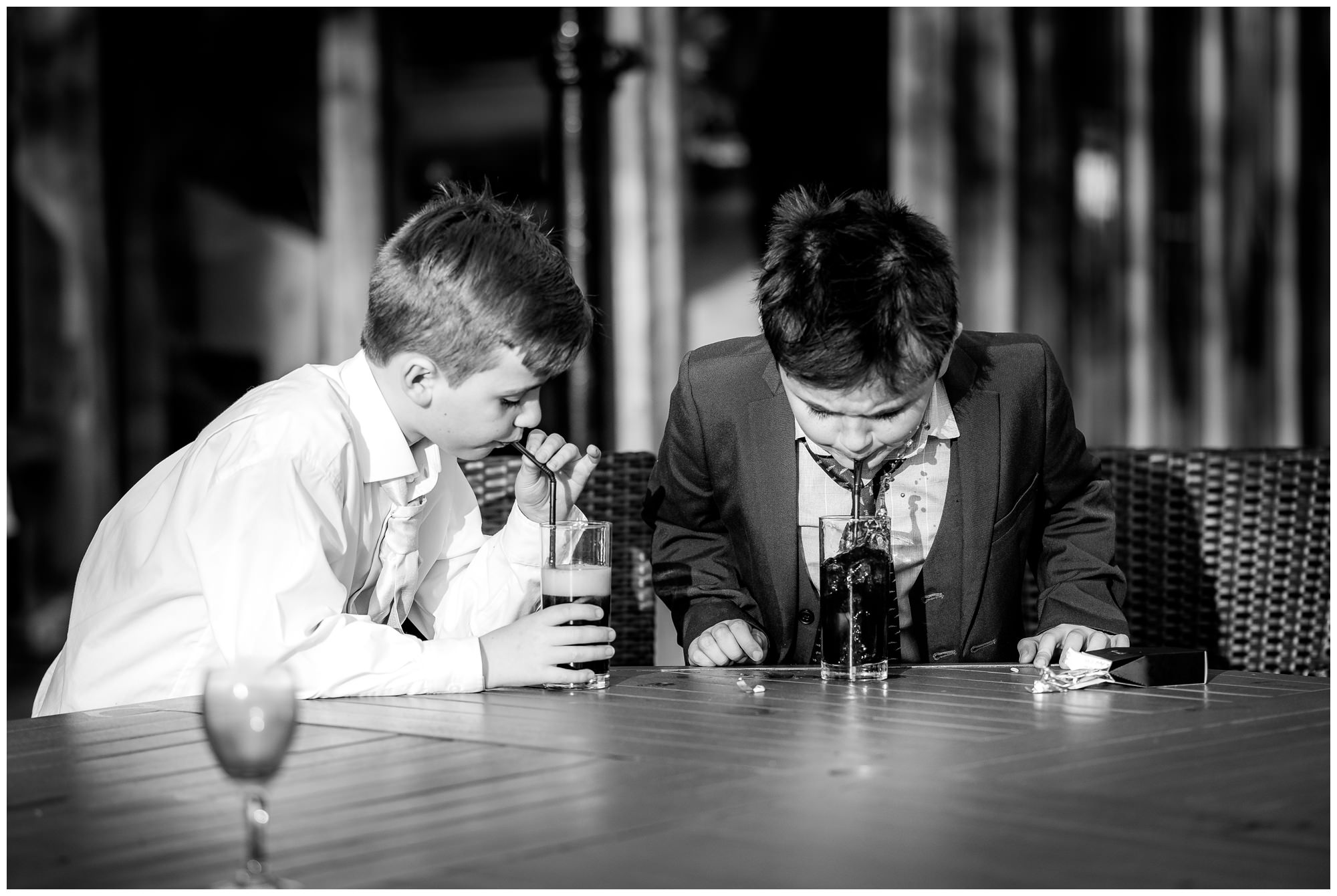 children blowing bubbles in their drinks