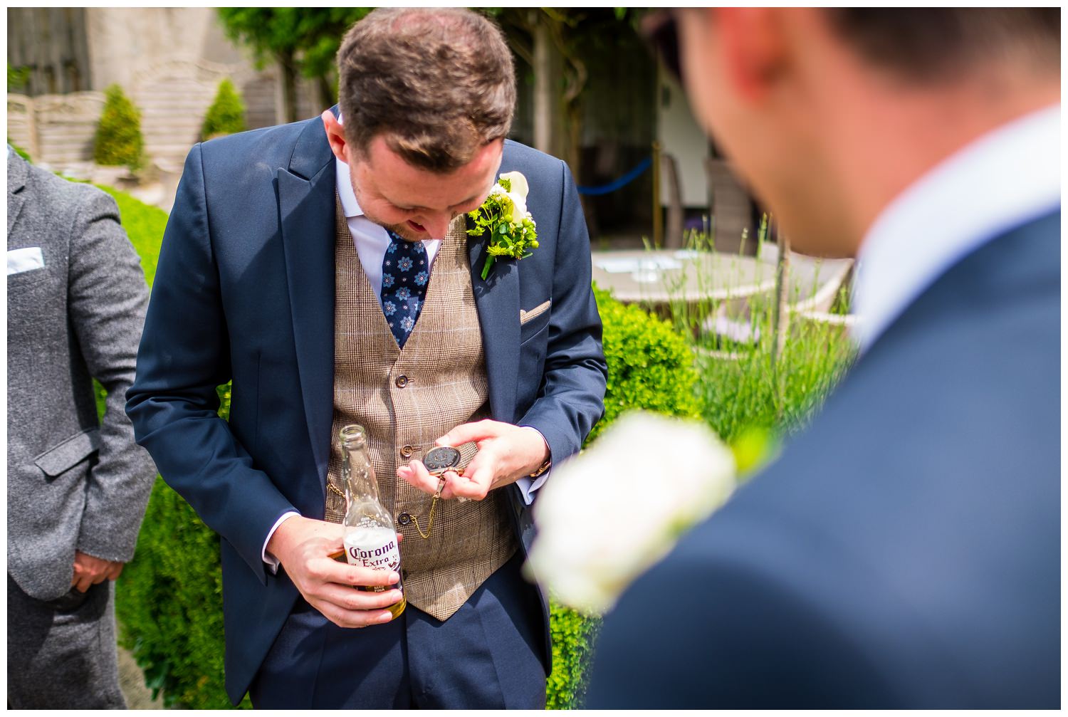 groom checking out his new pocket watch